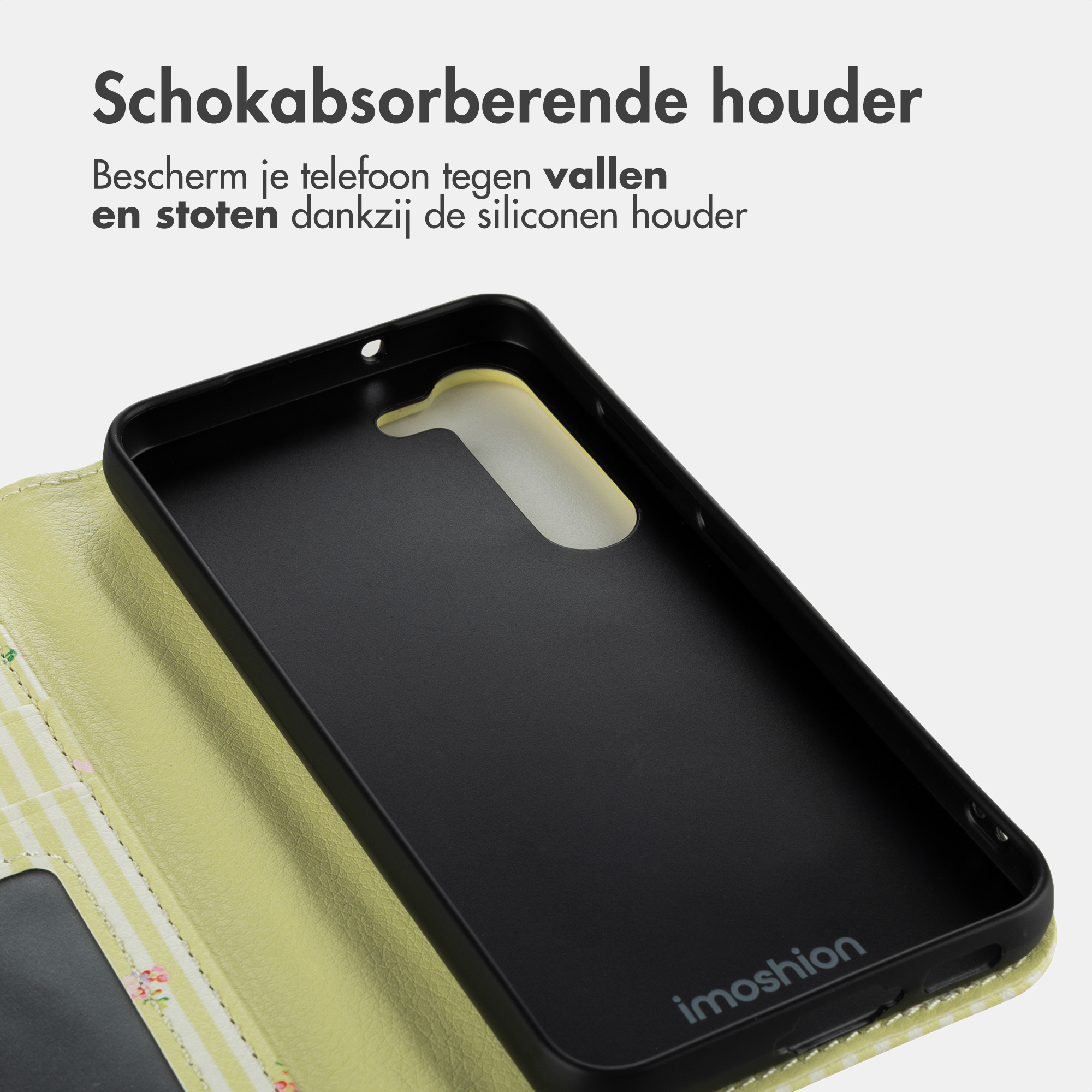 Ein schwarzes Handyhülle-Inlay mit gelbem Rand, neben einer geöffneten, hellgrünen Hülle.