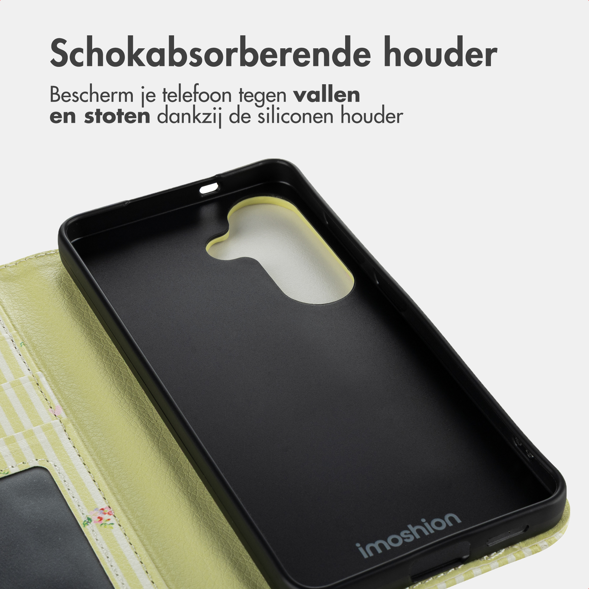 Een zwarte telefoonhoes met een lichtgroene gestreepte voering en bloemenpatroon.