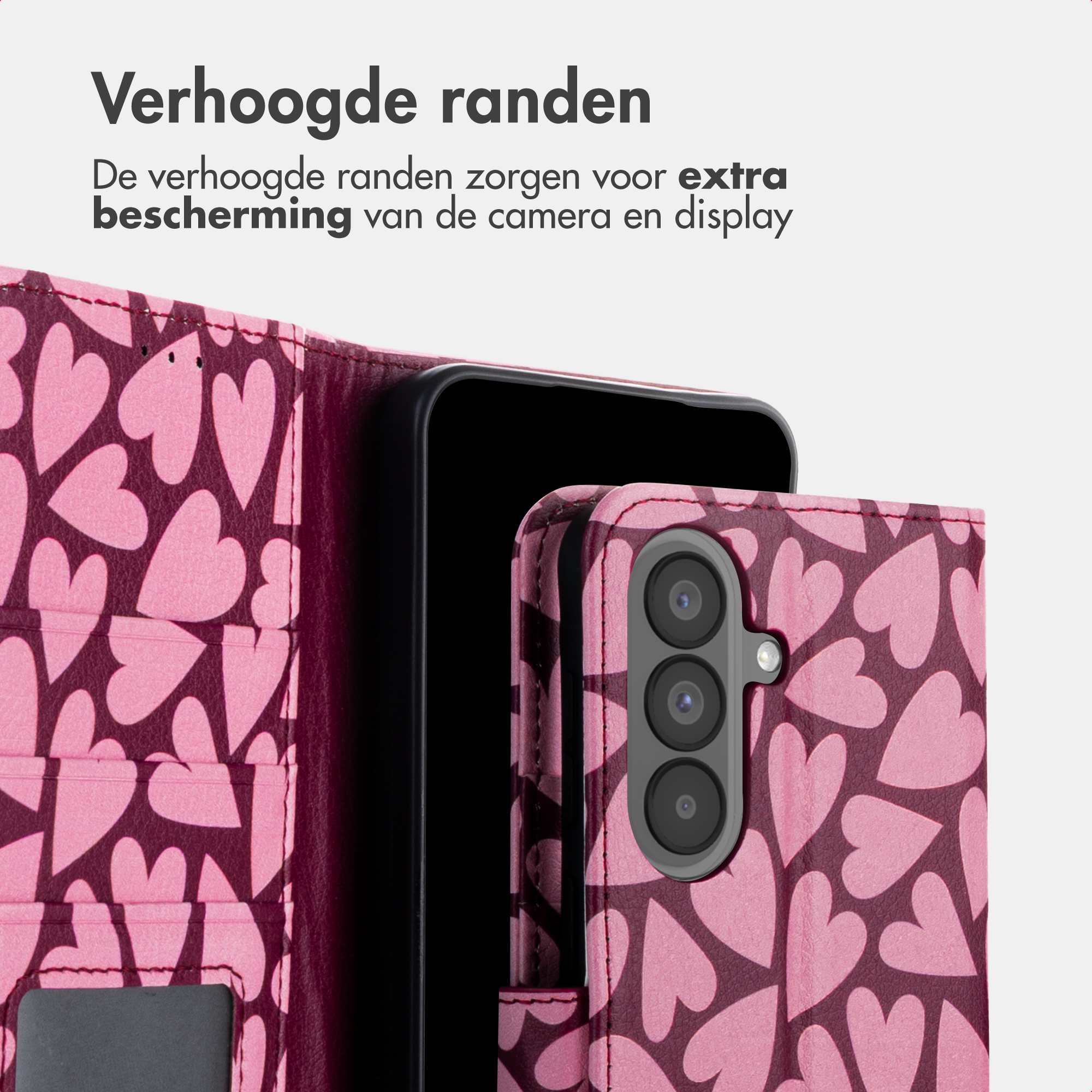 Ein pinkfarbenes Handycover mit Herzmuster, das eine Kamera zeigt.