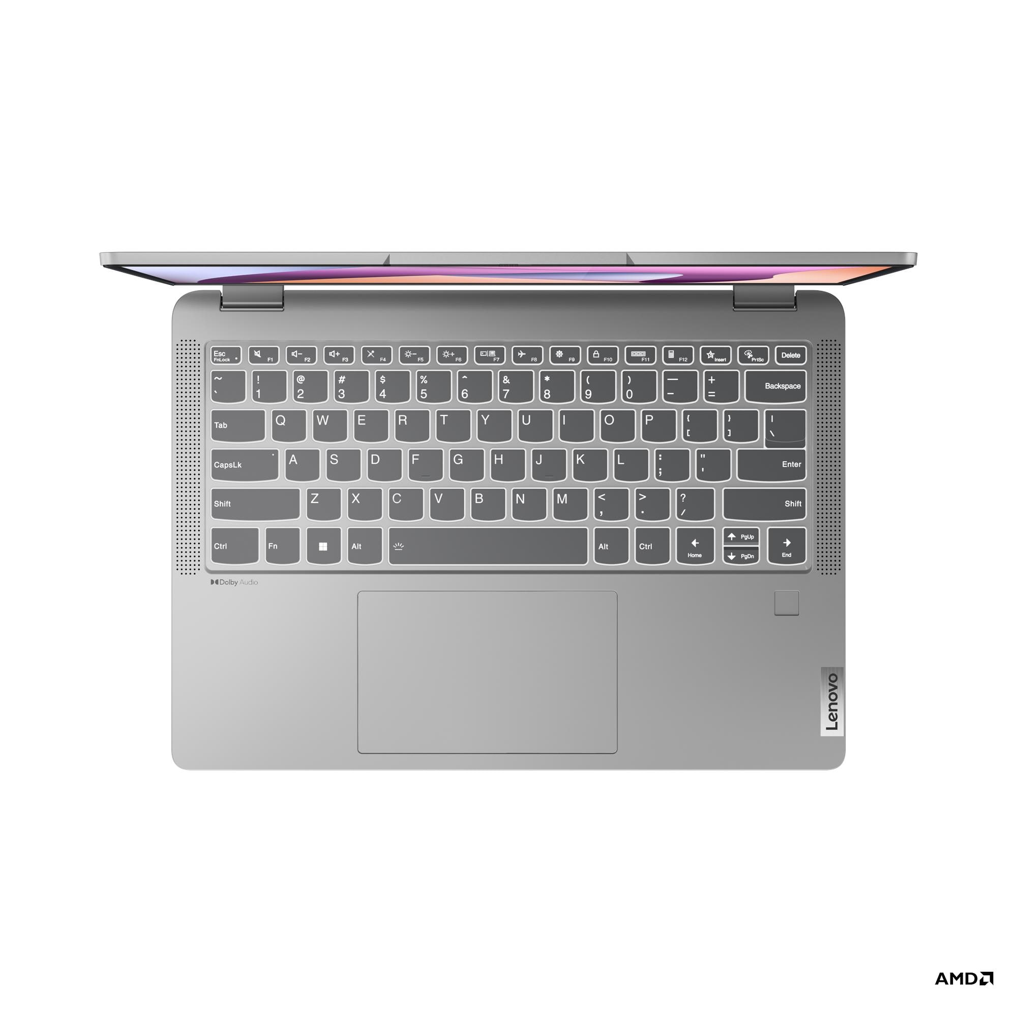 Un laptop argentato aperto con tastiera retroilluminata e touchpad.