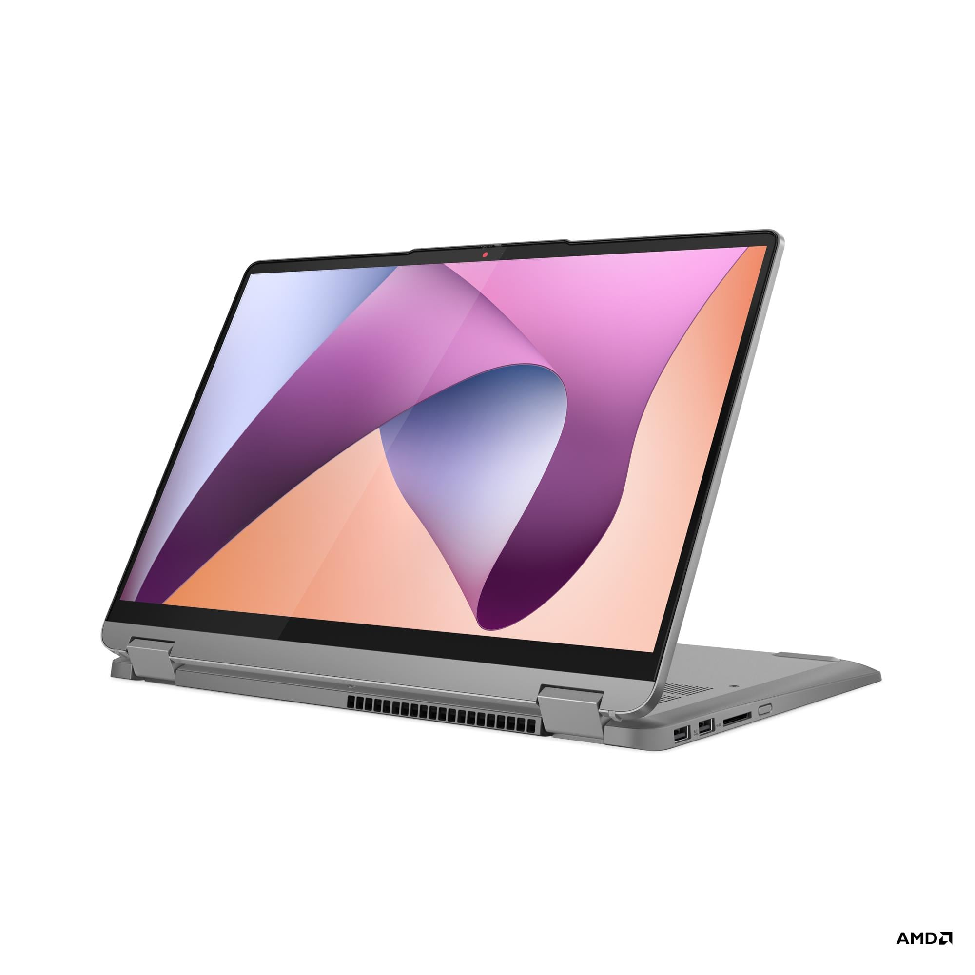 Un laptop argentato è aperto, con uno sfondo astratto e colorato sul suo schermo.