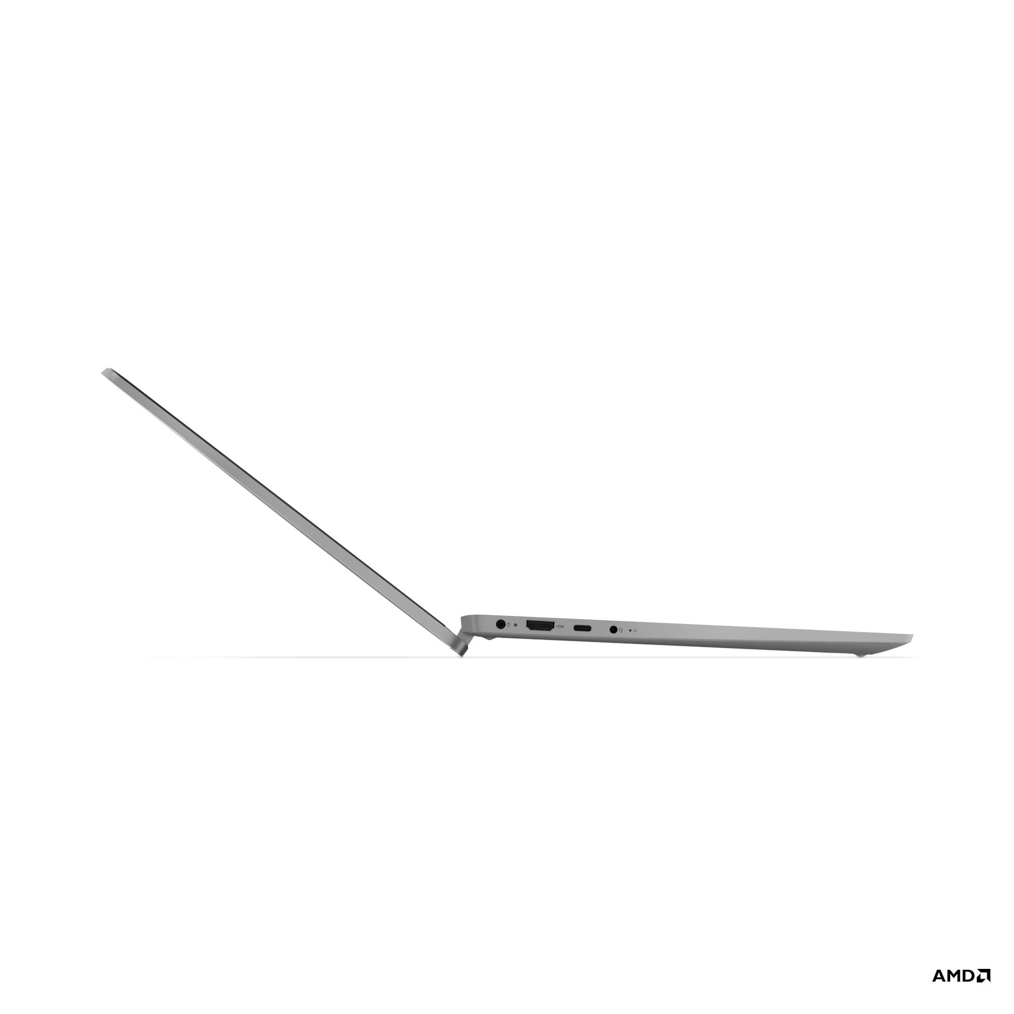 Laptop grigio su sfondo bianco, vista laterale con porte.