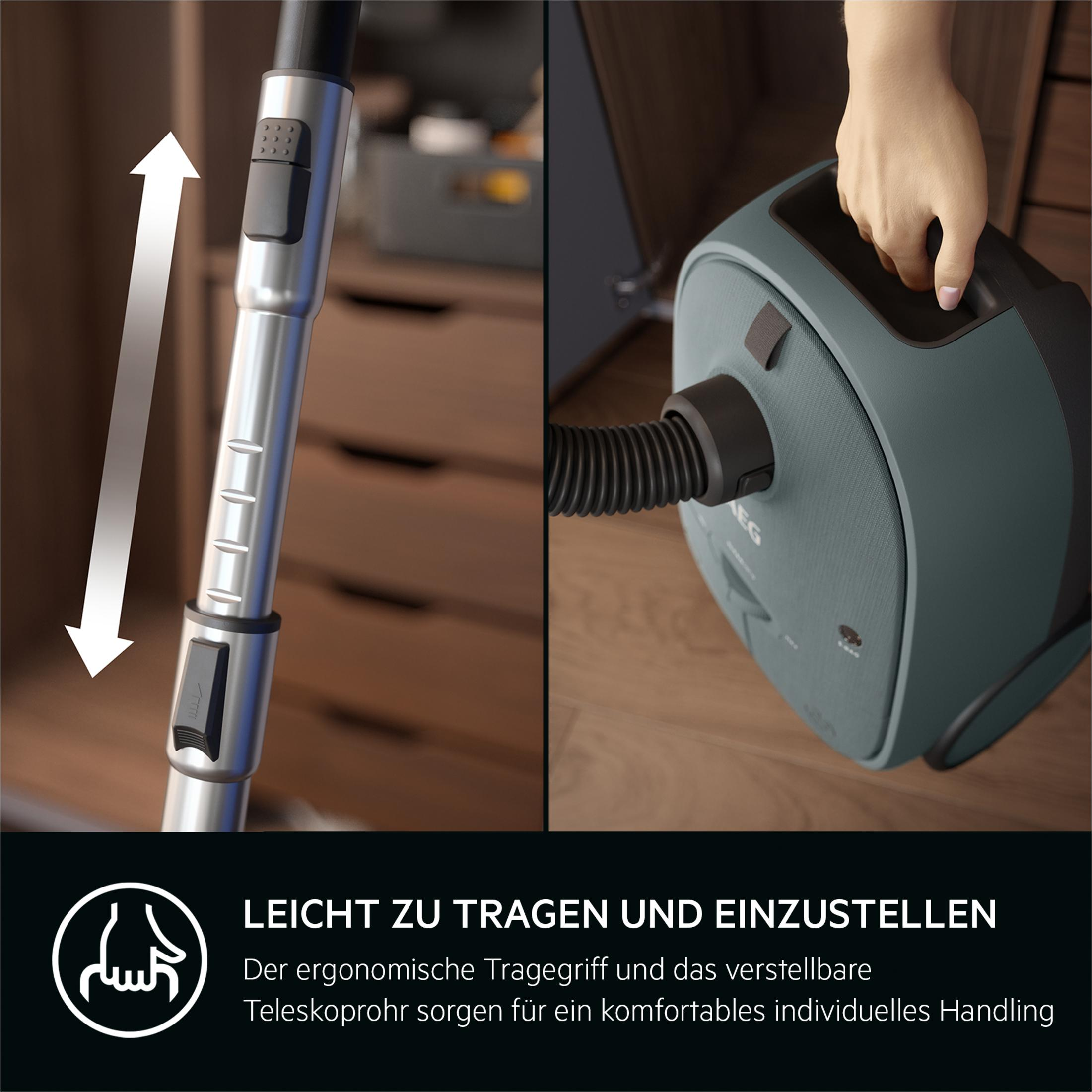Grijze stofzuiger met handvat en telescopische buis. Makkelijk te dragen en te verstellen.