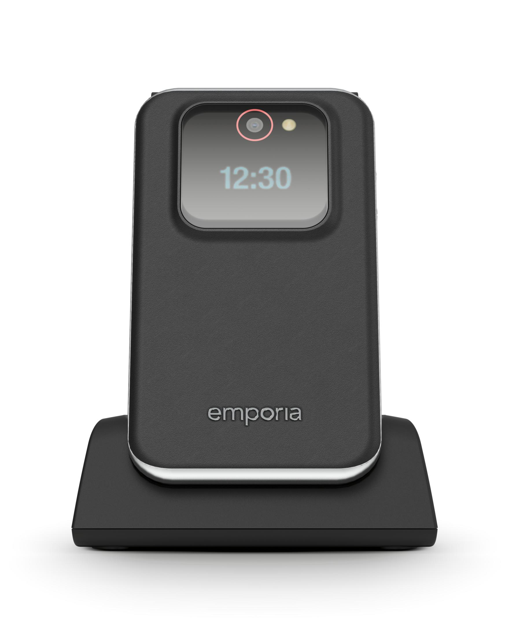 Un telefono Emporia nero su una base di ricarica, che mostra le 12:30.