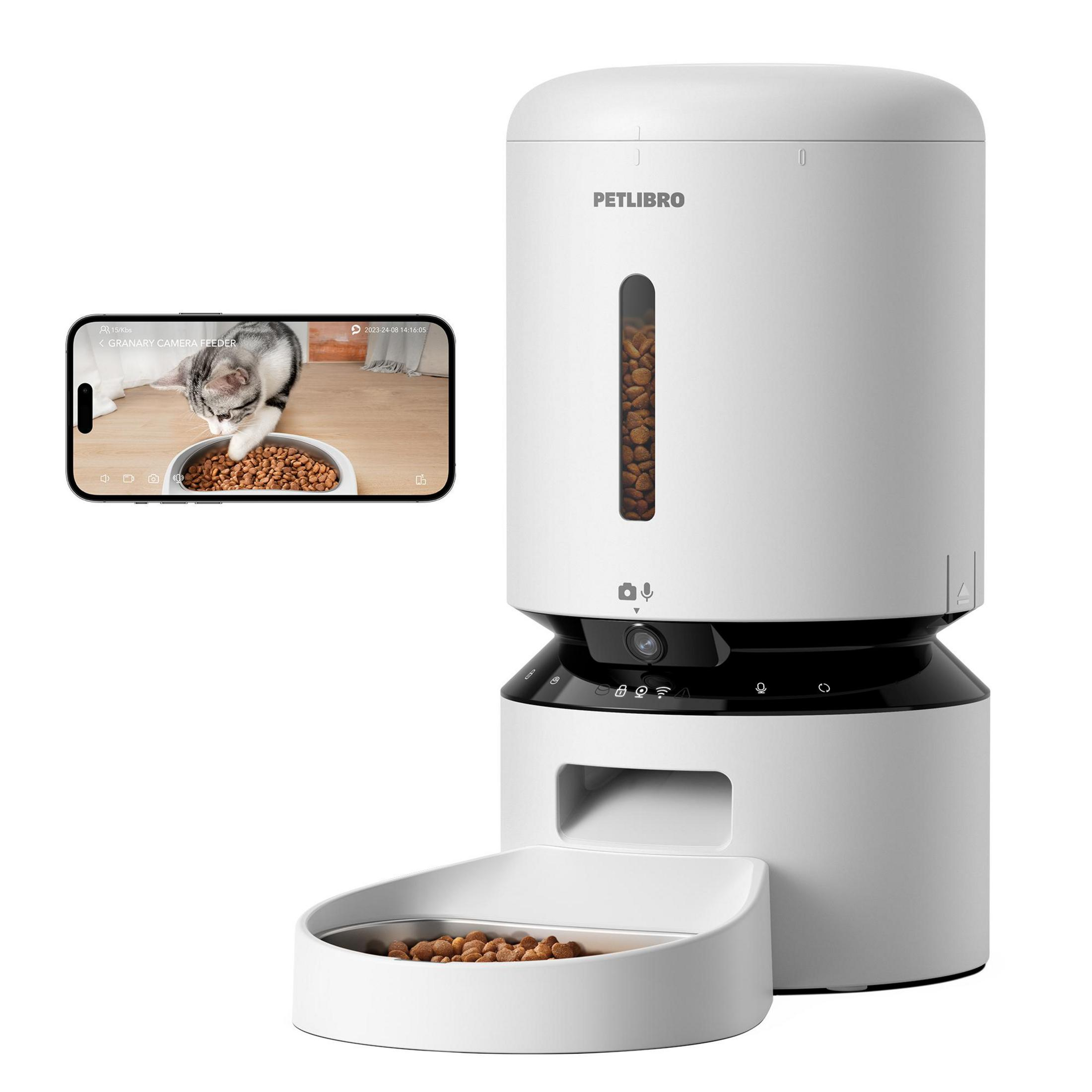 A white pet feeder with a camera view of a cat eating from a bowl.