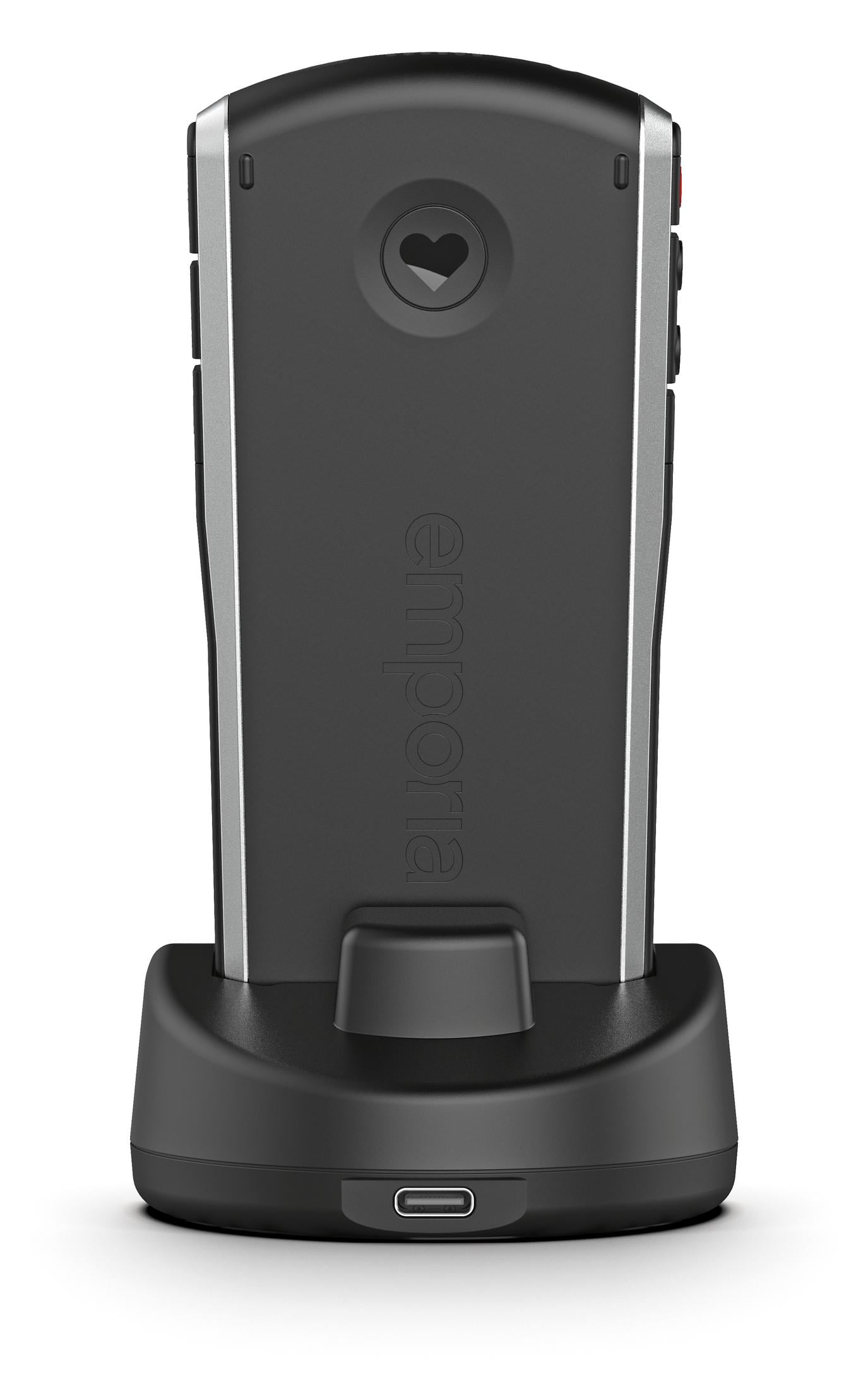 Schwarzes Emporia-Telefon in Ladestation. Herzlogo auf der Rückseite. USB-Anschluss an der Dockingstation.