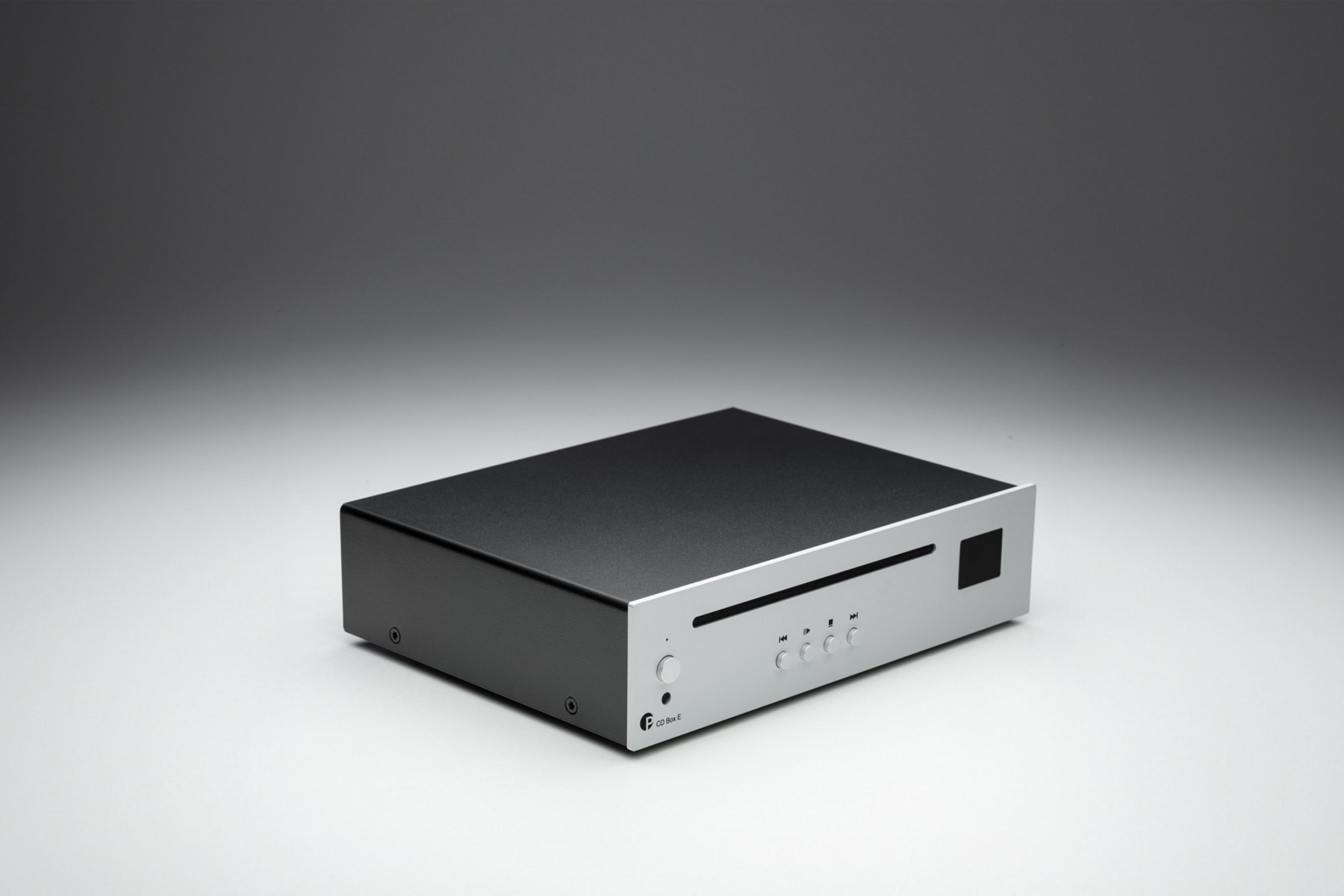 A silver and black CD player with control buttons and a slot.