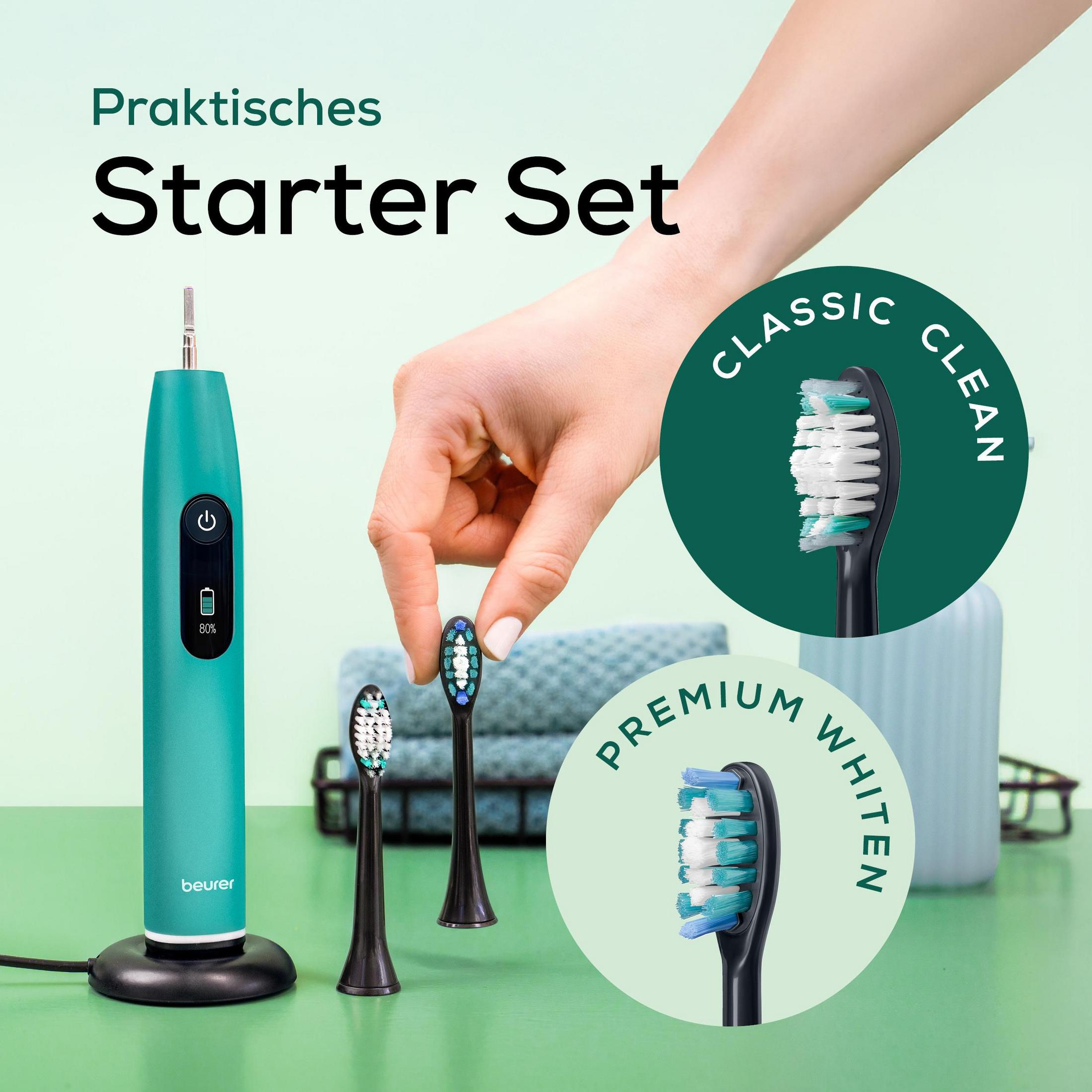Een turquoise sonische tandenborstelset met opzetborstels en oplaadstation.