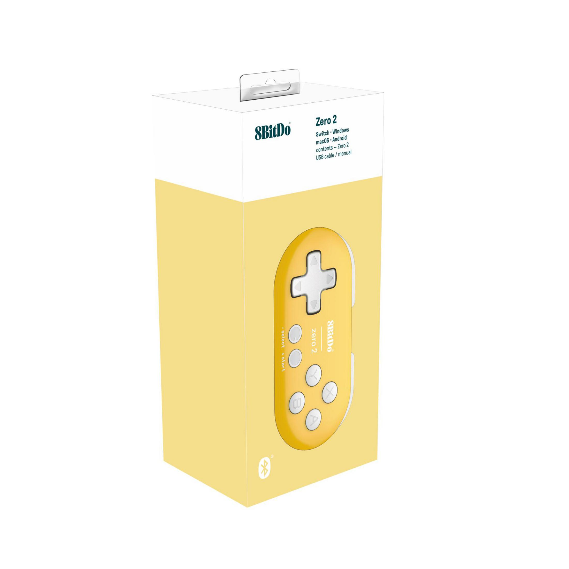 Gamepad giallo 8BitDo Zero 2 all'interno di una scatola aperta con etichette.