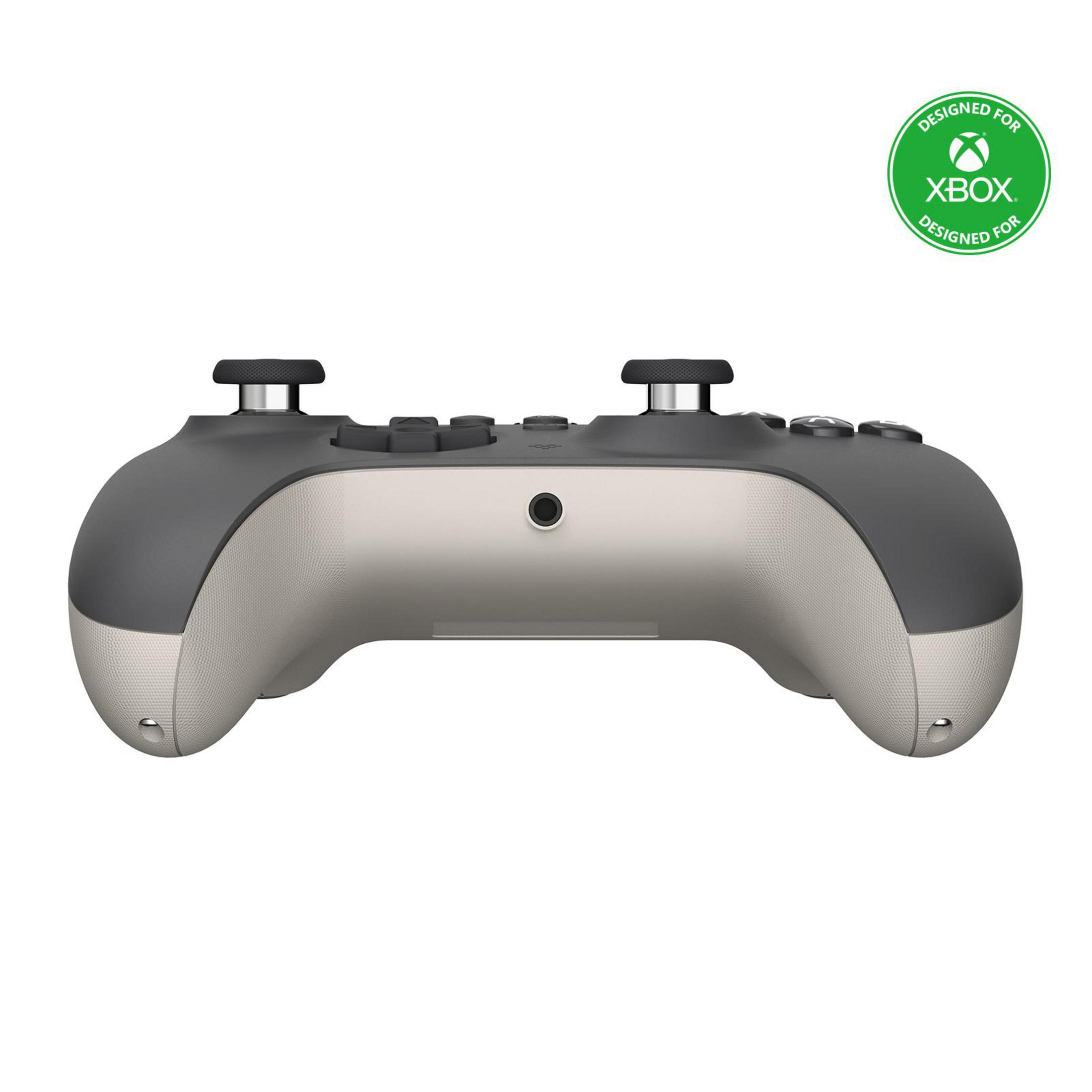 Eine zweifarbige Xbox-Controller in Grau und Beige, mit grünem Logo 'Designed for Xbox'.