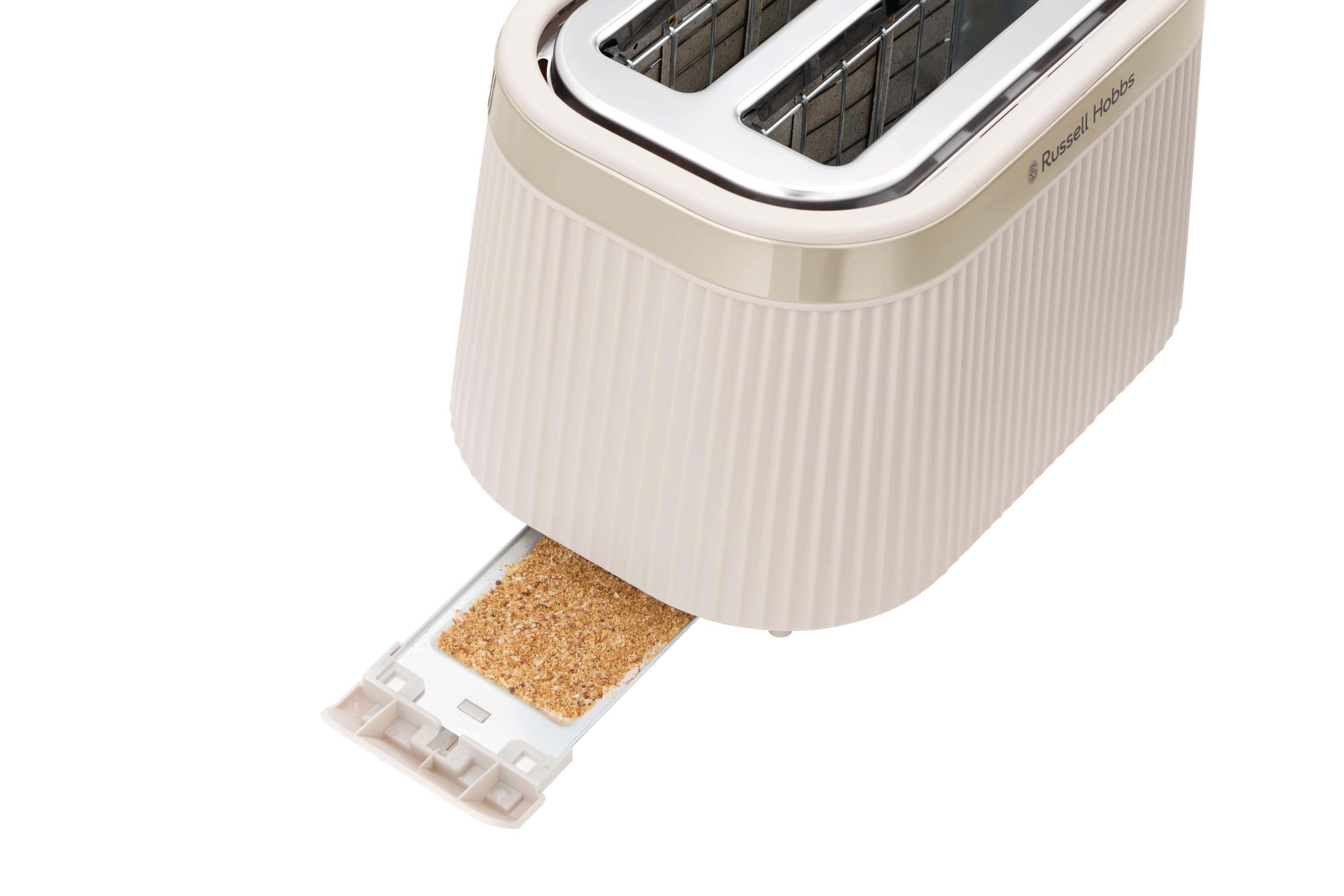 Ein cremefarbener Toaster mit einem herausgezogenen Krümelschubfach voller Krümel.