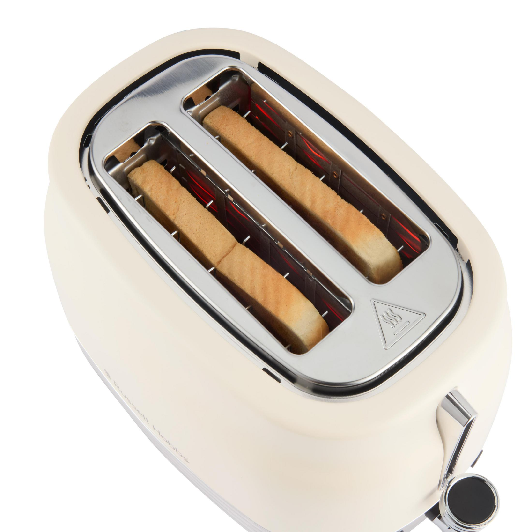 Ein cremefarbener Toaster mit zwei Brotscheiben, die toasten.