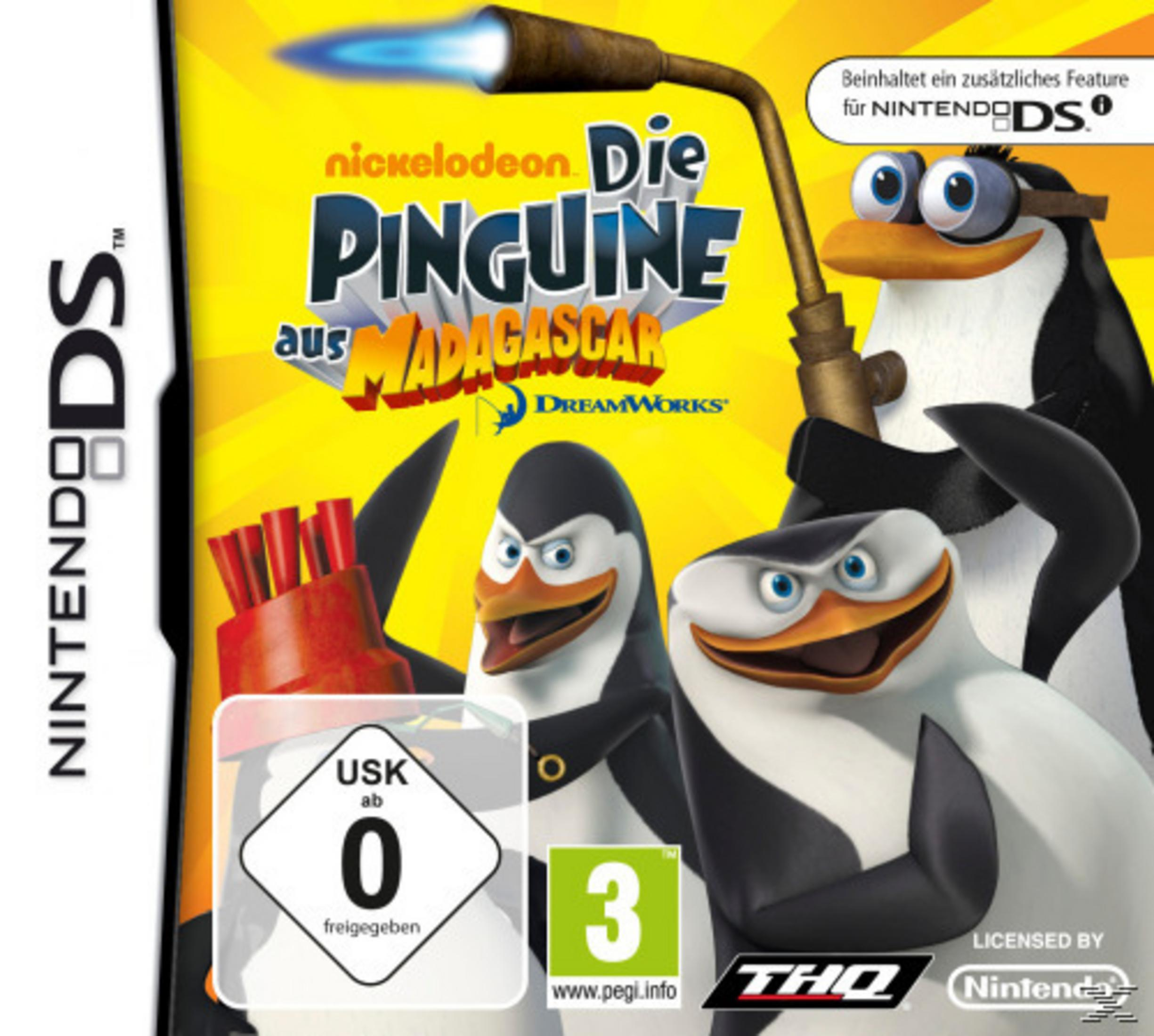 Die Pinguine aus Madagascar Nintendo DS Spielbox mit Flammenwerfer und drei Pinguinen.