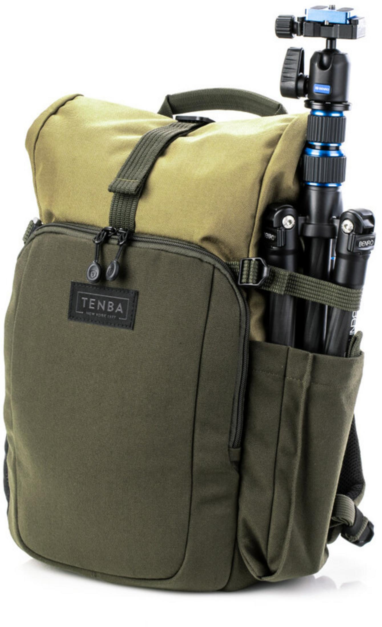 A green Tenba camera backpack with two tripods attached to the side.