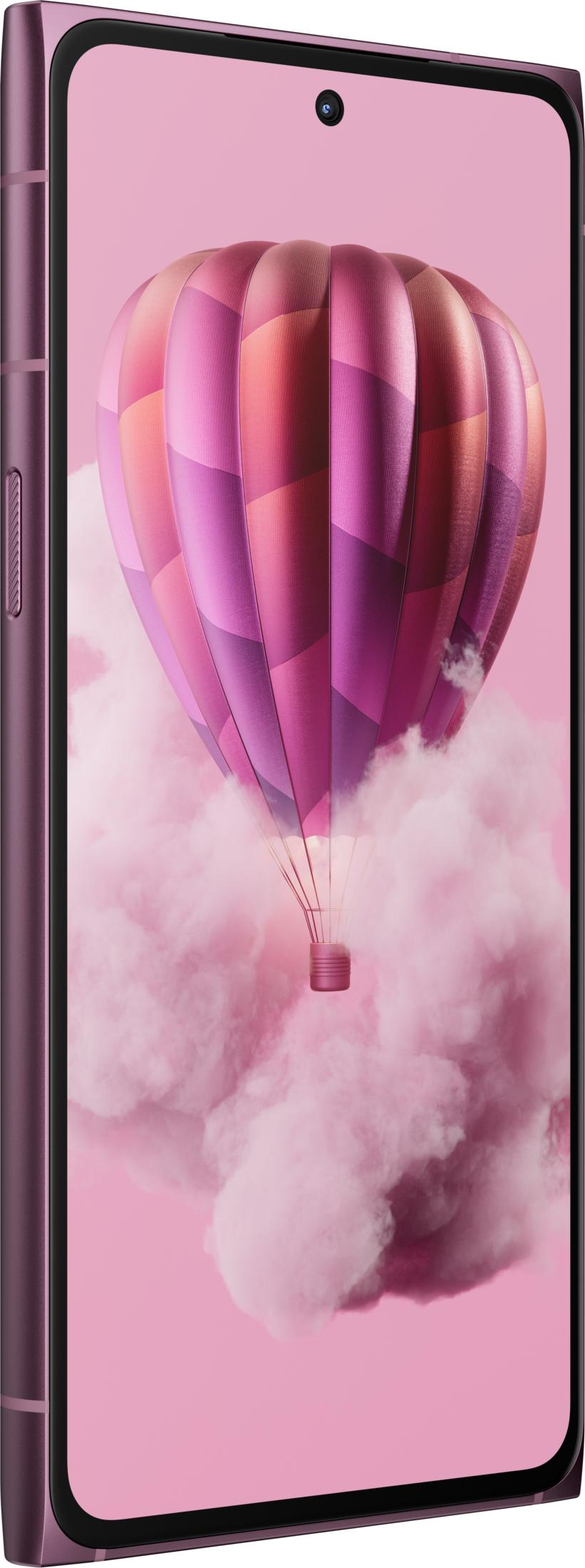 Ein violetter Heißluftballon schwebt in rosa Wolken.