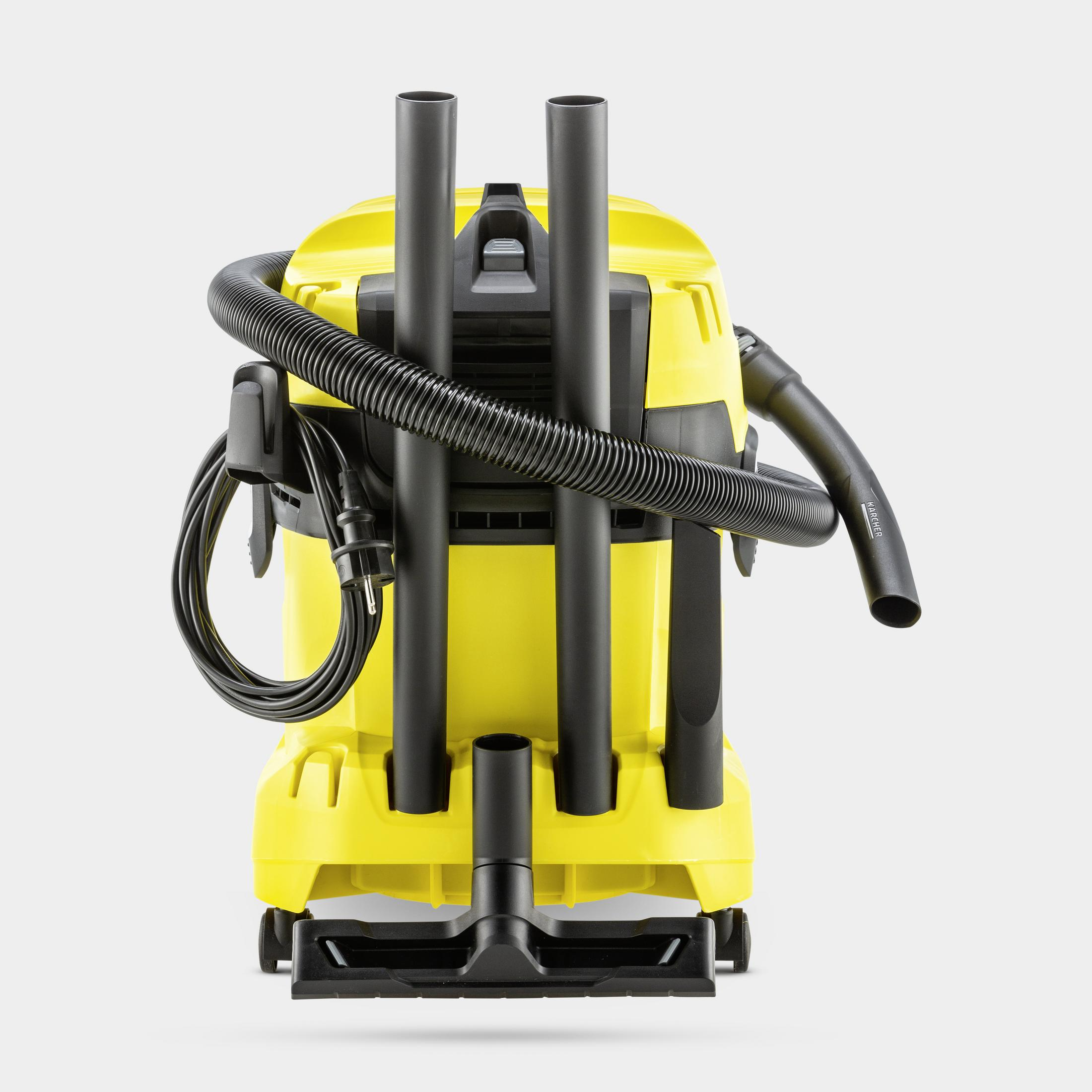 Un aspirapolvere bagnato/asciutto giallo con tubo e cavi neri.