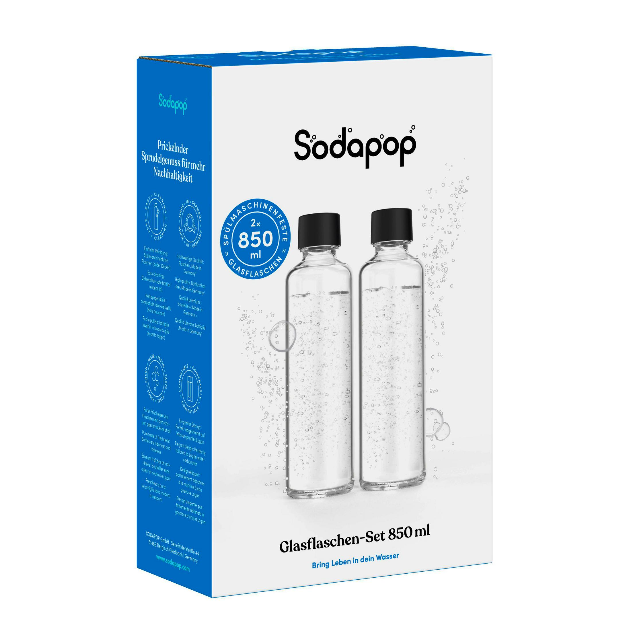 Due bottiglie di vetro Sodapop trasparenti con tappi neri su confezione bianca.