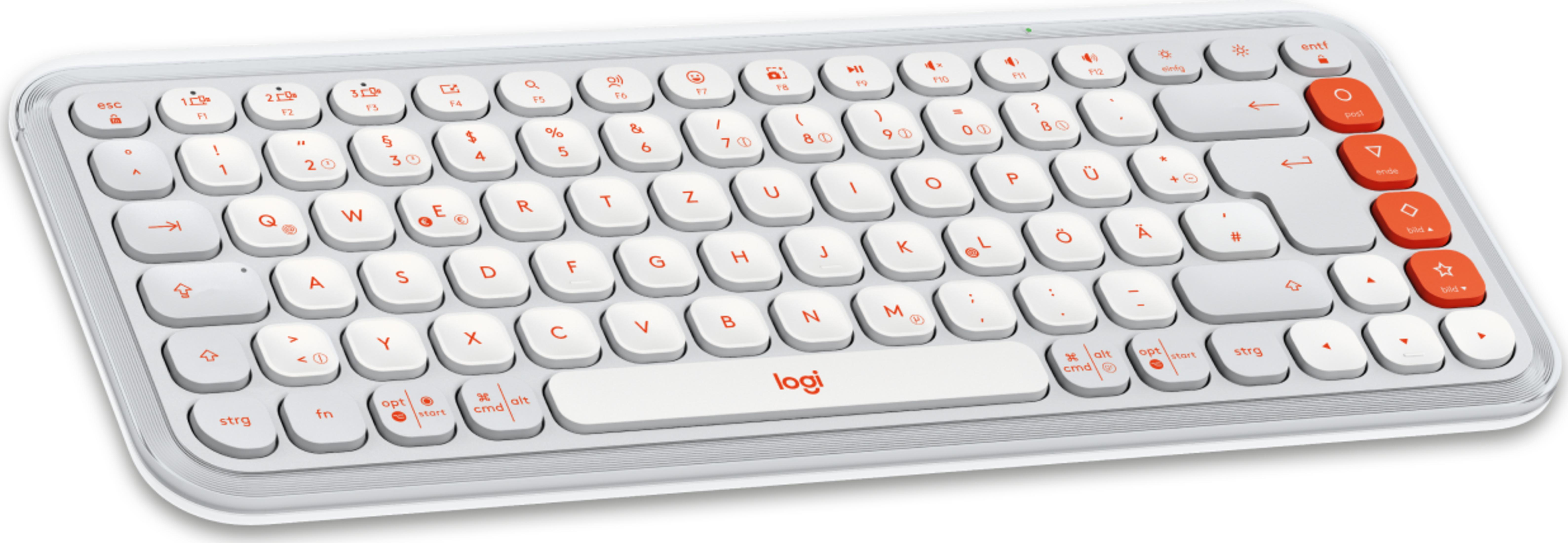 Un teclado blanco con teclas de acento rojas y letras negras.