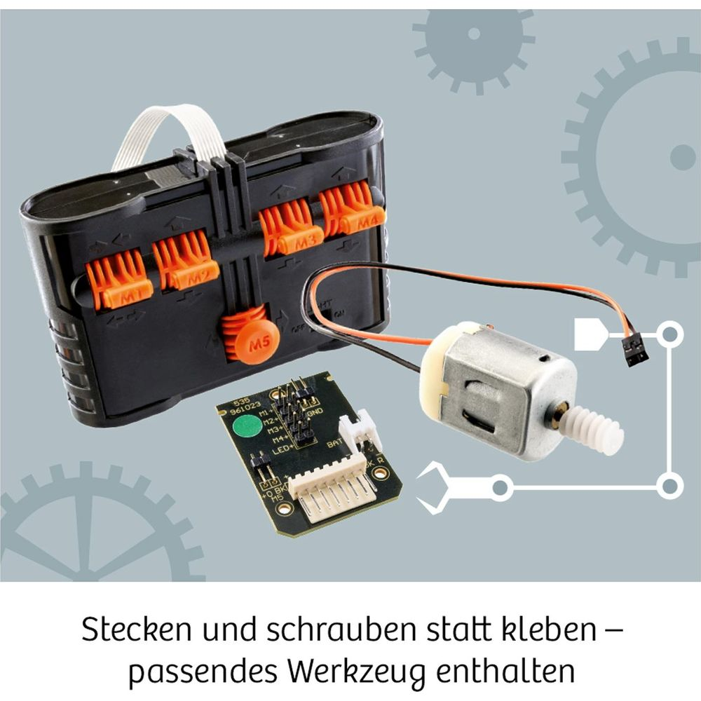 Ein schwarzer Bausteinkasten mit orangen Anschlüssen, Motor und Platine.