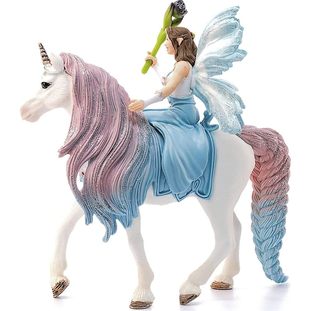 Weiße Einhornfigur mit Fee, die einen Stab hält. Rosa-blaue Mähne und Schweif.