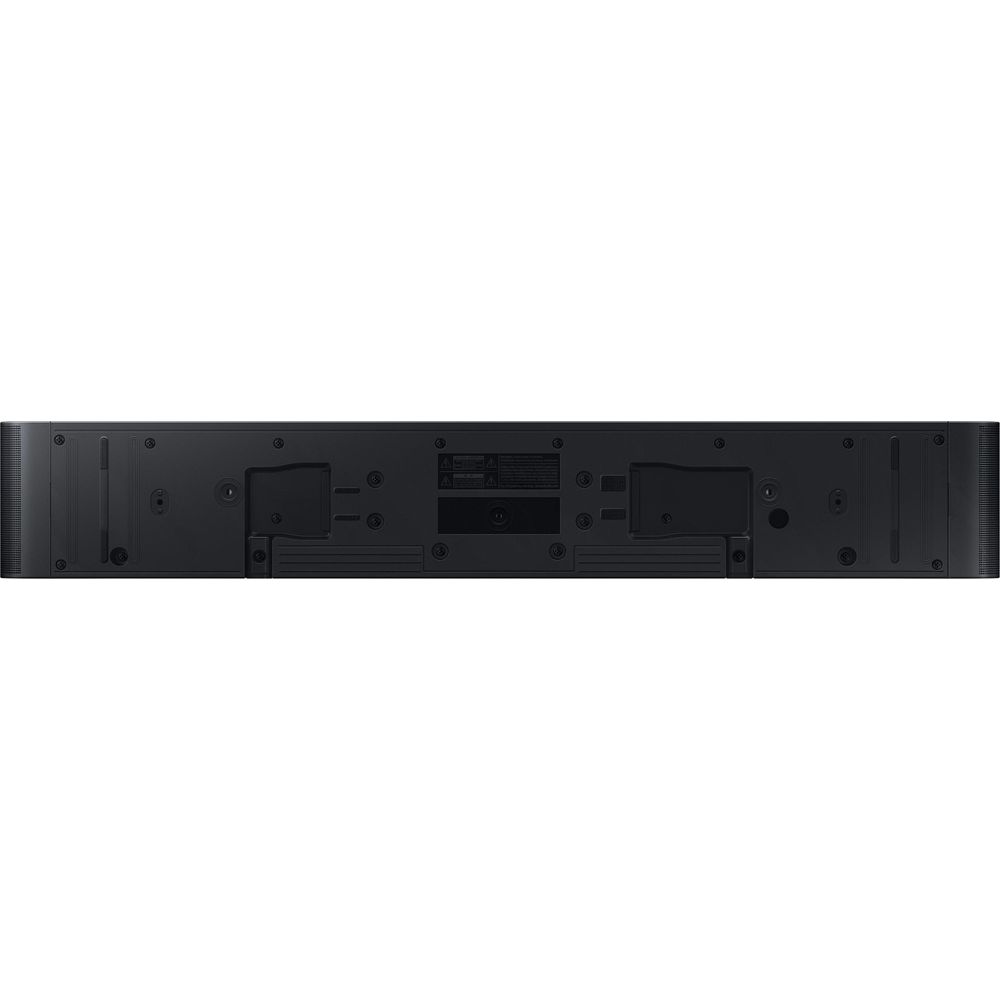 Retro di una soundbar nera con porte ed etichette di avvertenza.
