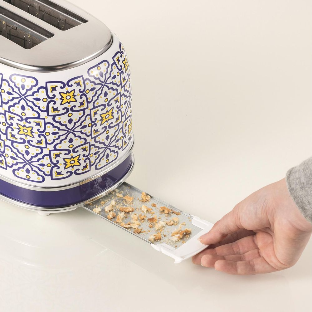 Mavi-sarı desenli tost makinesi, çekilen kırıntı tepsisi.