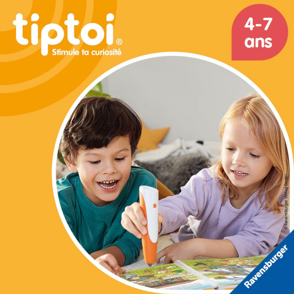 Dos niños, un niño y una niña, usan un bolígrafo Tiptoi en un libro. Edades 4-7.