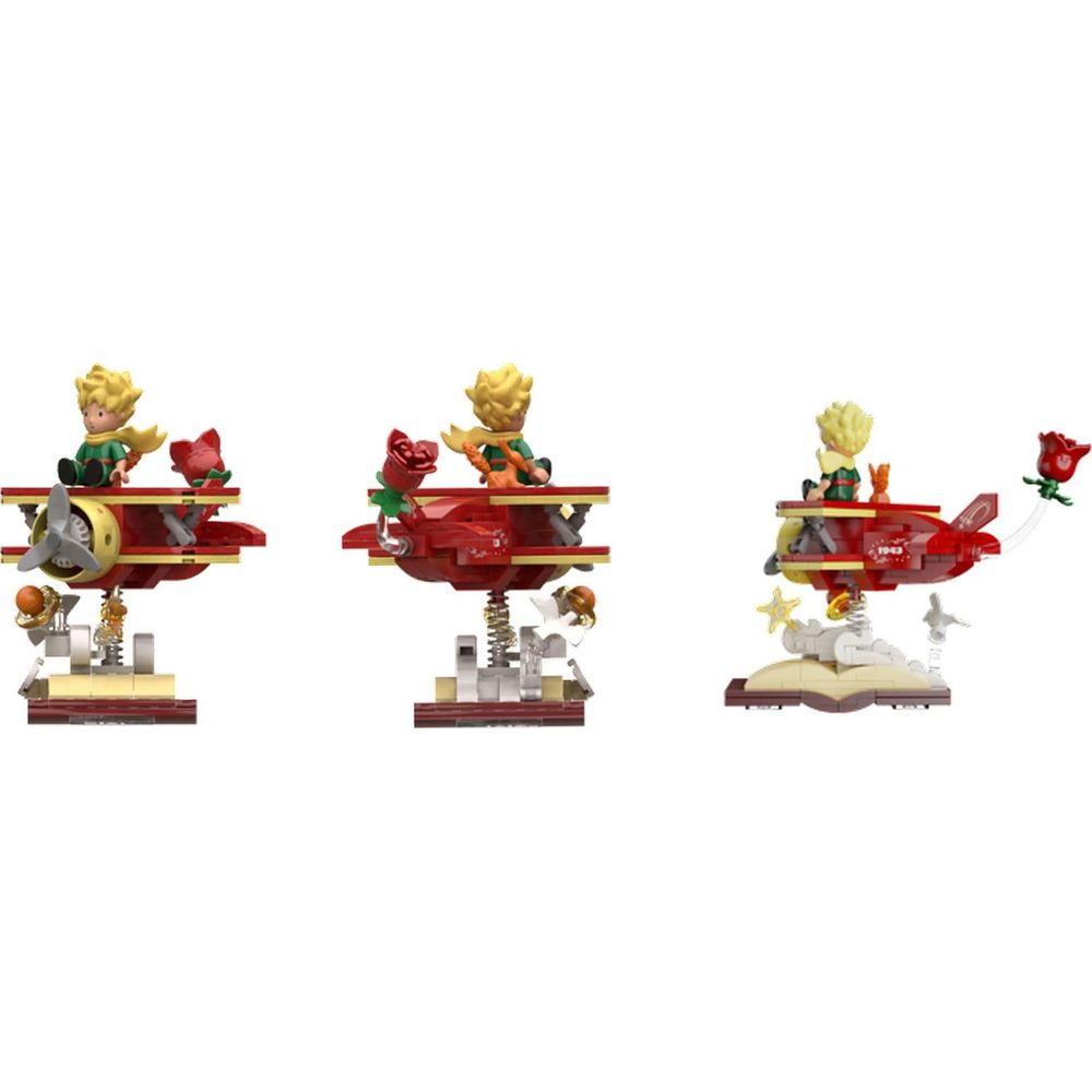 Drei Lego-Modelle des Kleinen Prinzen im roten Doppeldecker mit Rose.