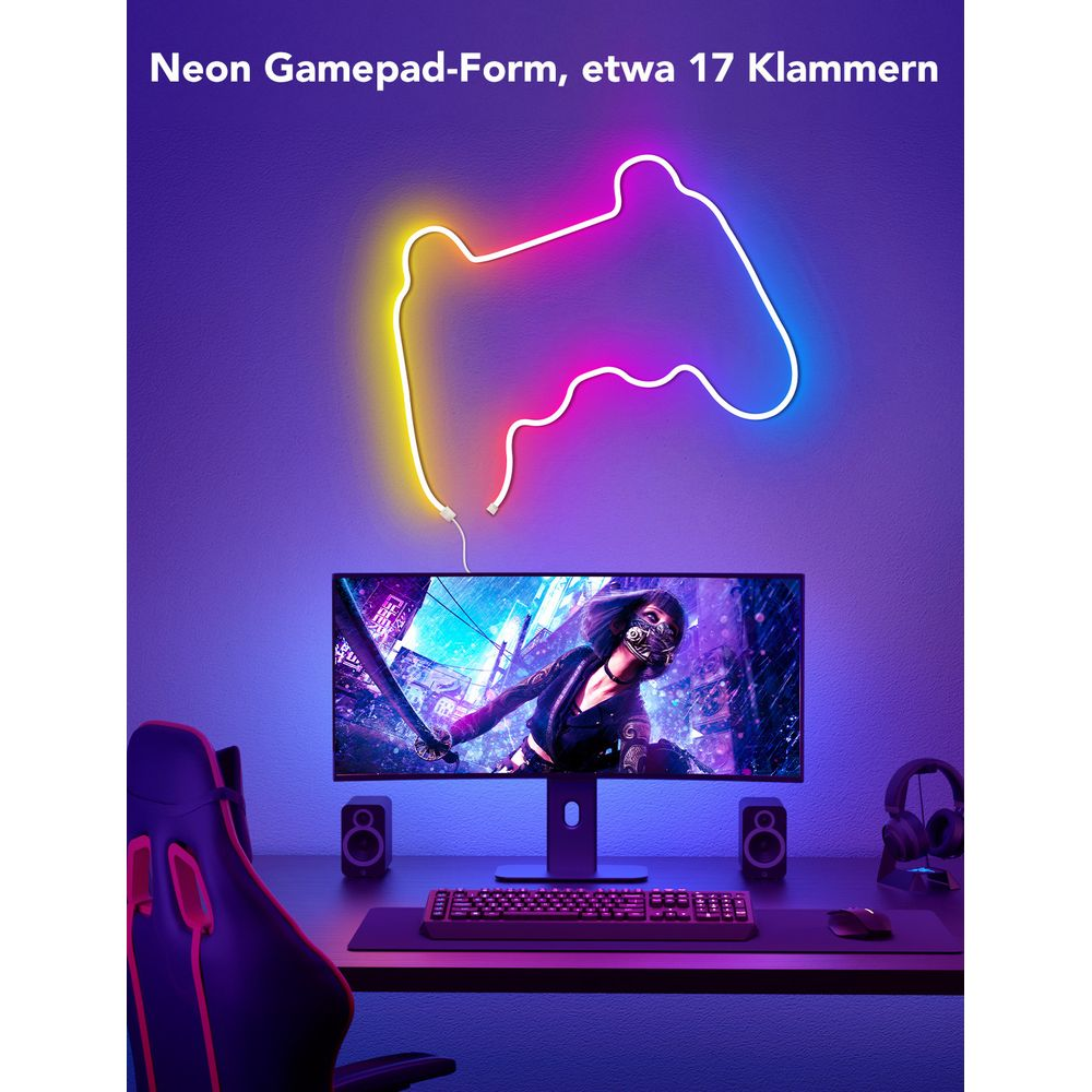 Ein leuchtendes Neonschild in Form eines Controllers, über einem Computermonitor auf einem Schreibtisch.