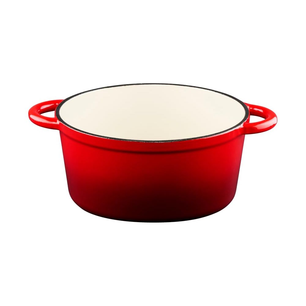 A red enameled cast iron pot with a white interior and two handles.
