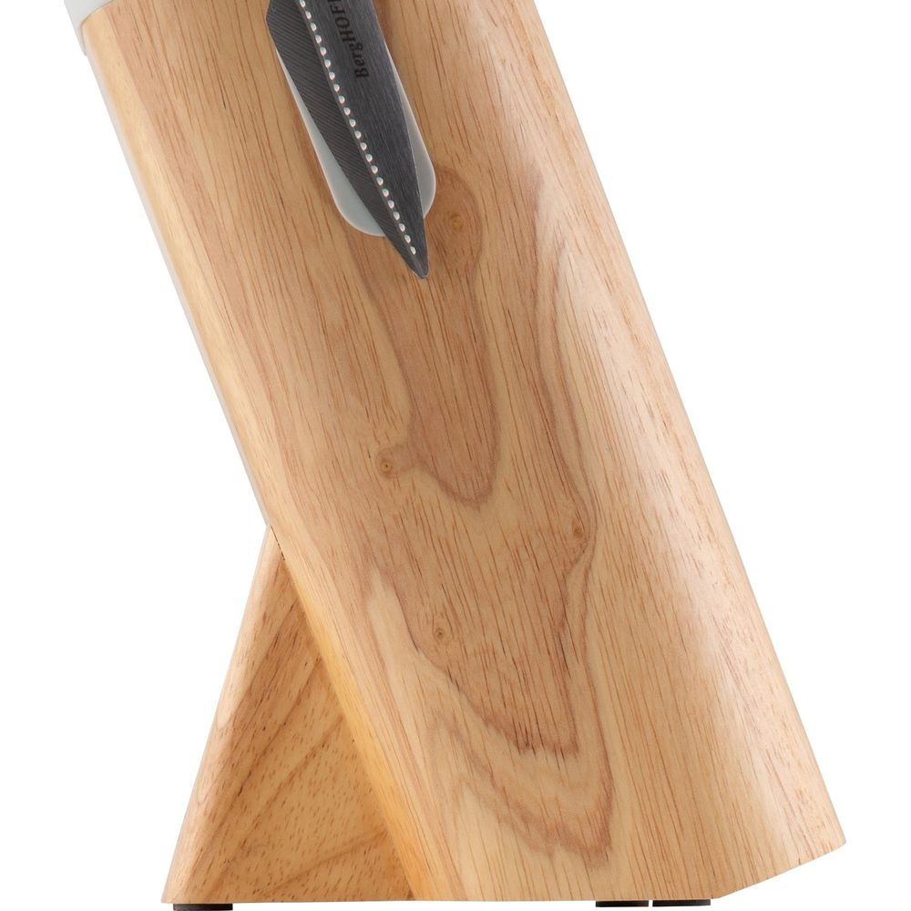 A wooden knife handle with 'BergHOFF' text on gray metal.