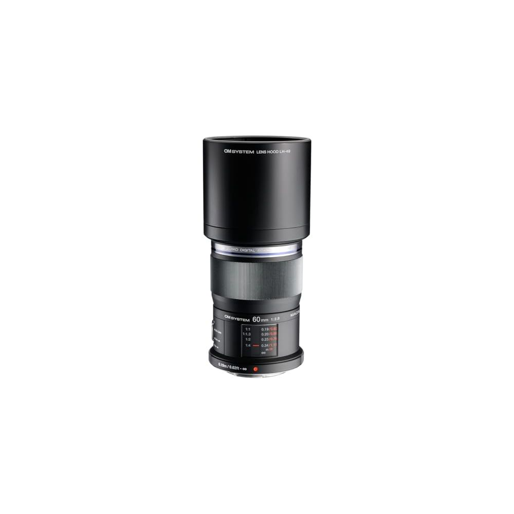 Black OM SYSTEM 60mm f/2.8 macro lens with hood. Focus scale visible.