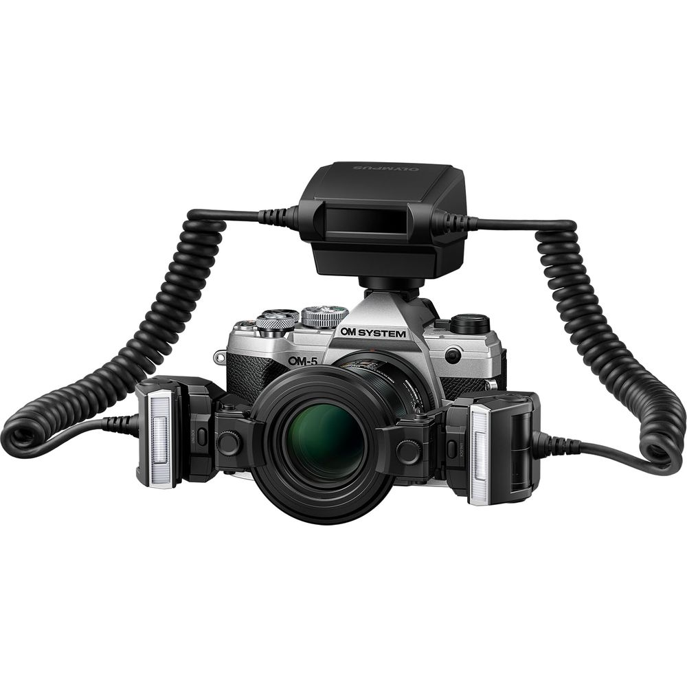 Silver camera with lens and two flashes connected by cables.