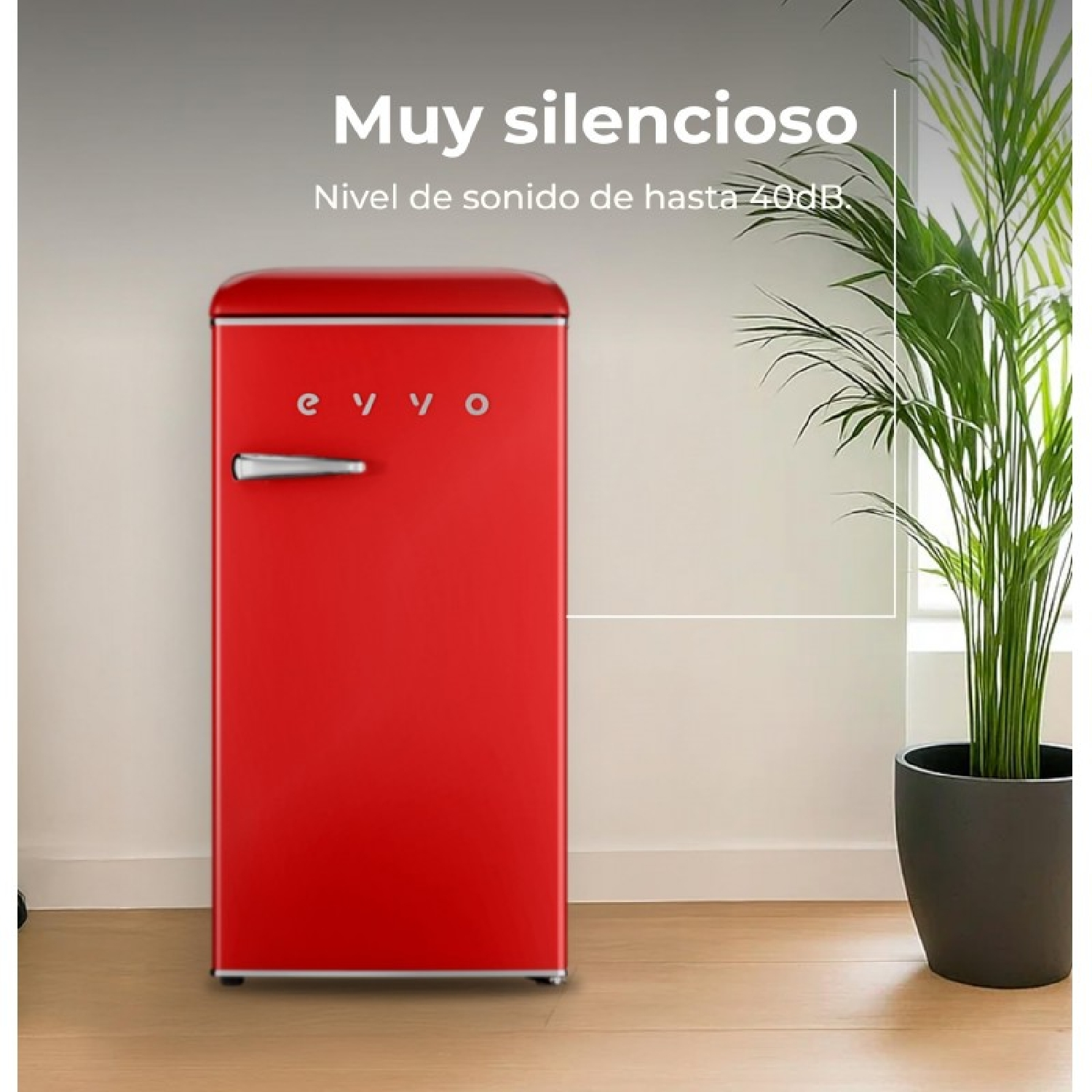 Un frigorifero rosso stile vintage accanto a una pianta in vaso.