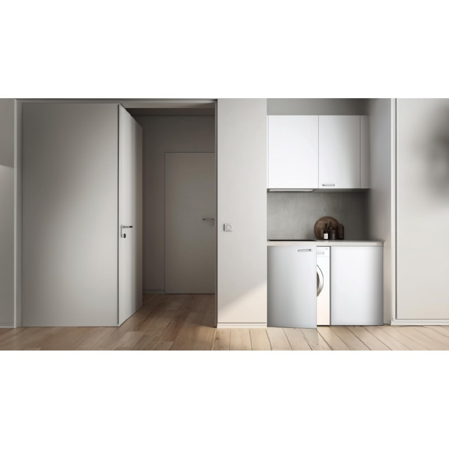 Lavadero minimalista con armarios blancos, lavadora y suelo de madera.
