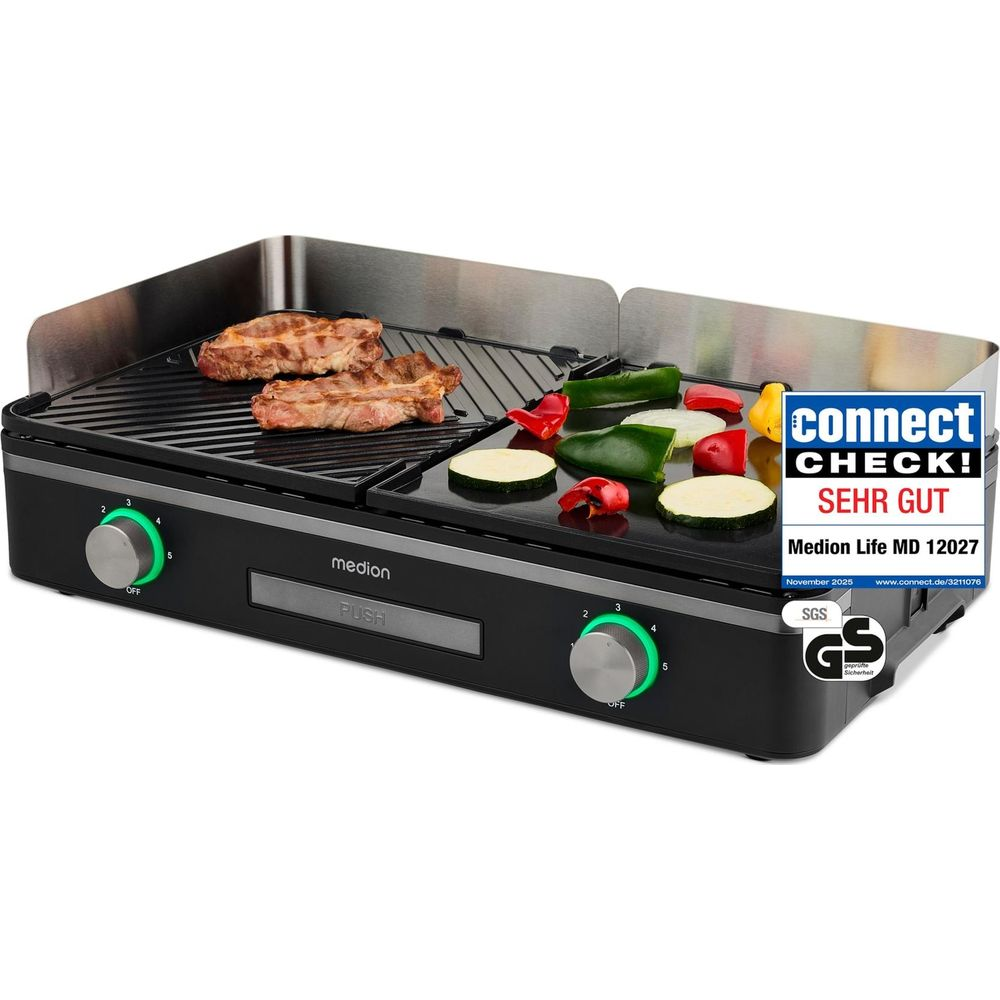 A black Medion electric grill with two steaks and chopped vegetables cooking.
