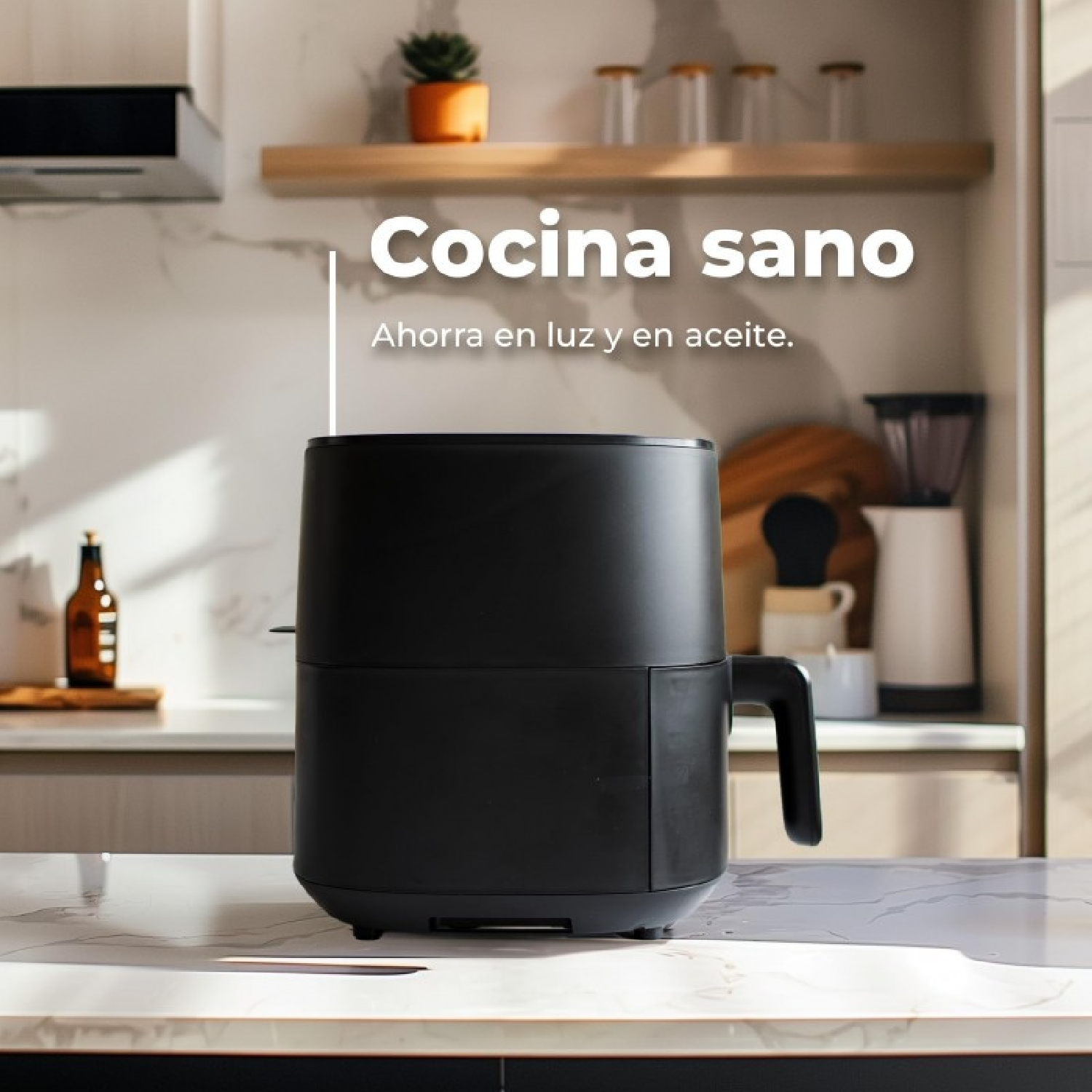 Una freidora de aire negra sobre una encimera de mármol en una cocina.