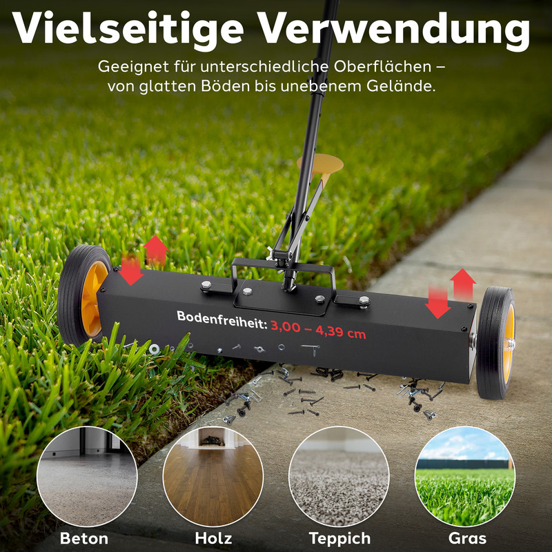 Magnetischer Bodenkehrer mit Rädern auf Gras und Beton, sammelt Schrauben.