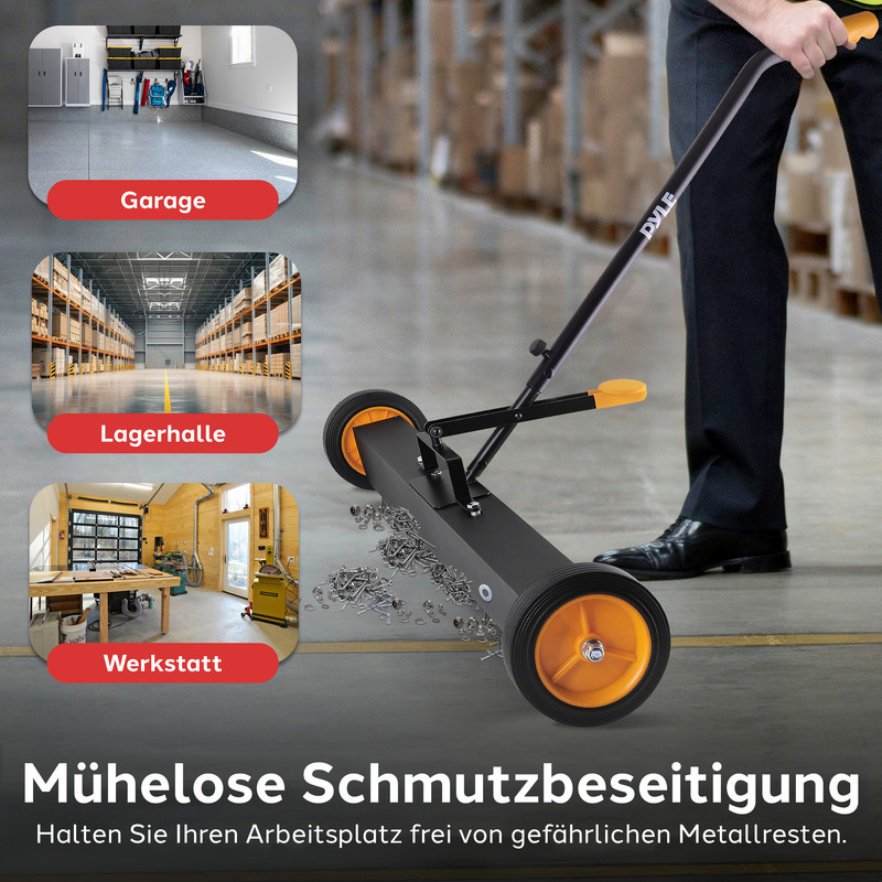 Ein Mann benutzt einen magnetischen Kehrblech, um Metallteile auf dem Boden aufzusammeln.