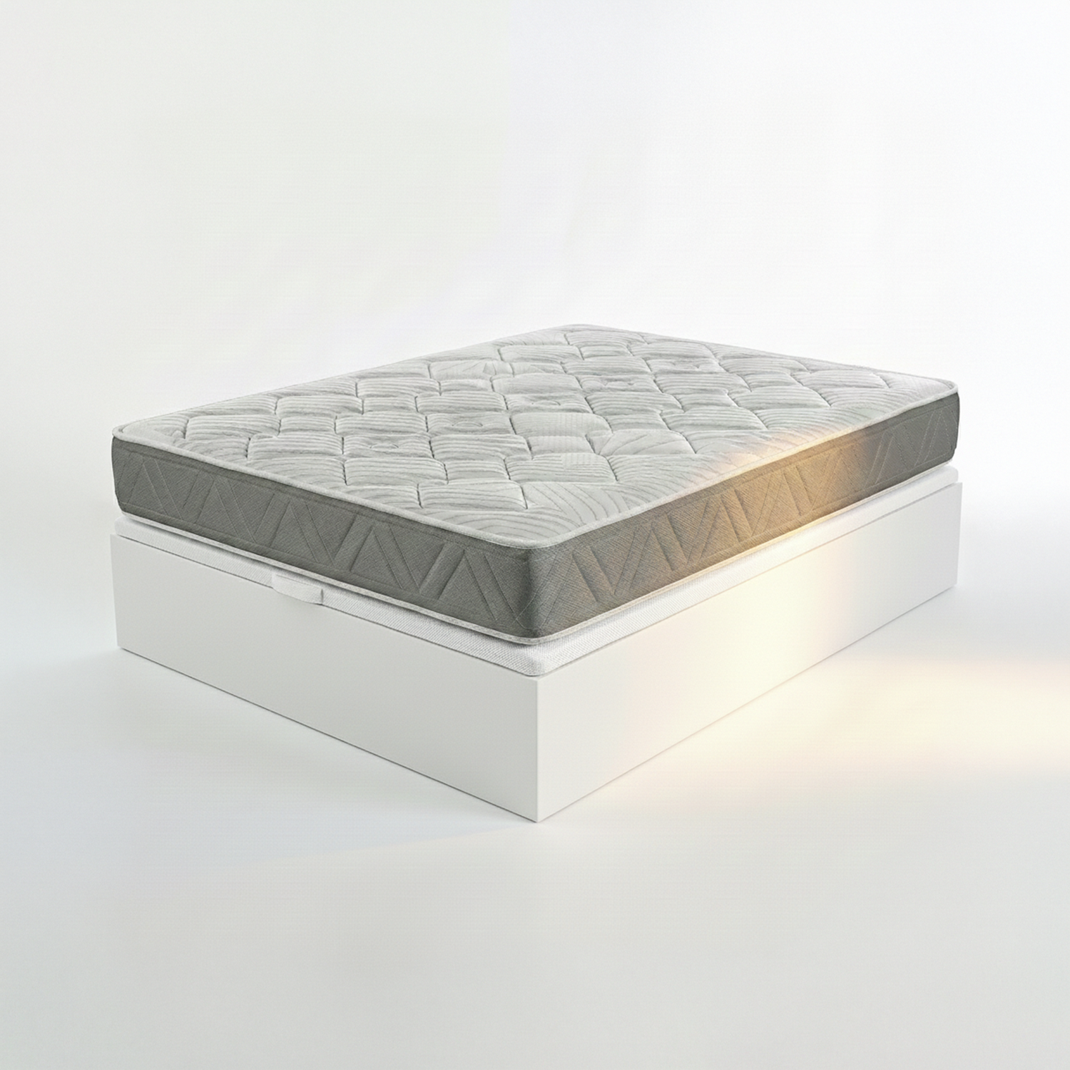Colchón gris con patrón sobre una base de cama blanca, toma de estudio.