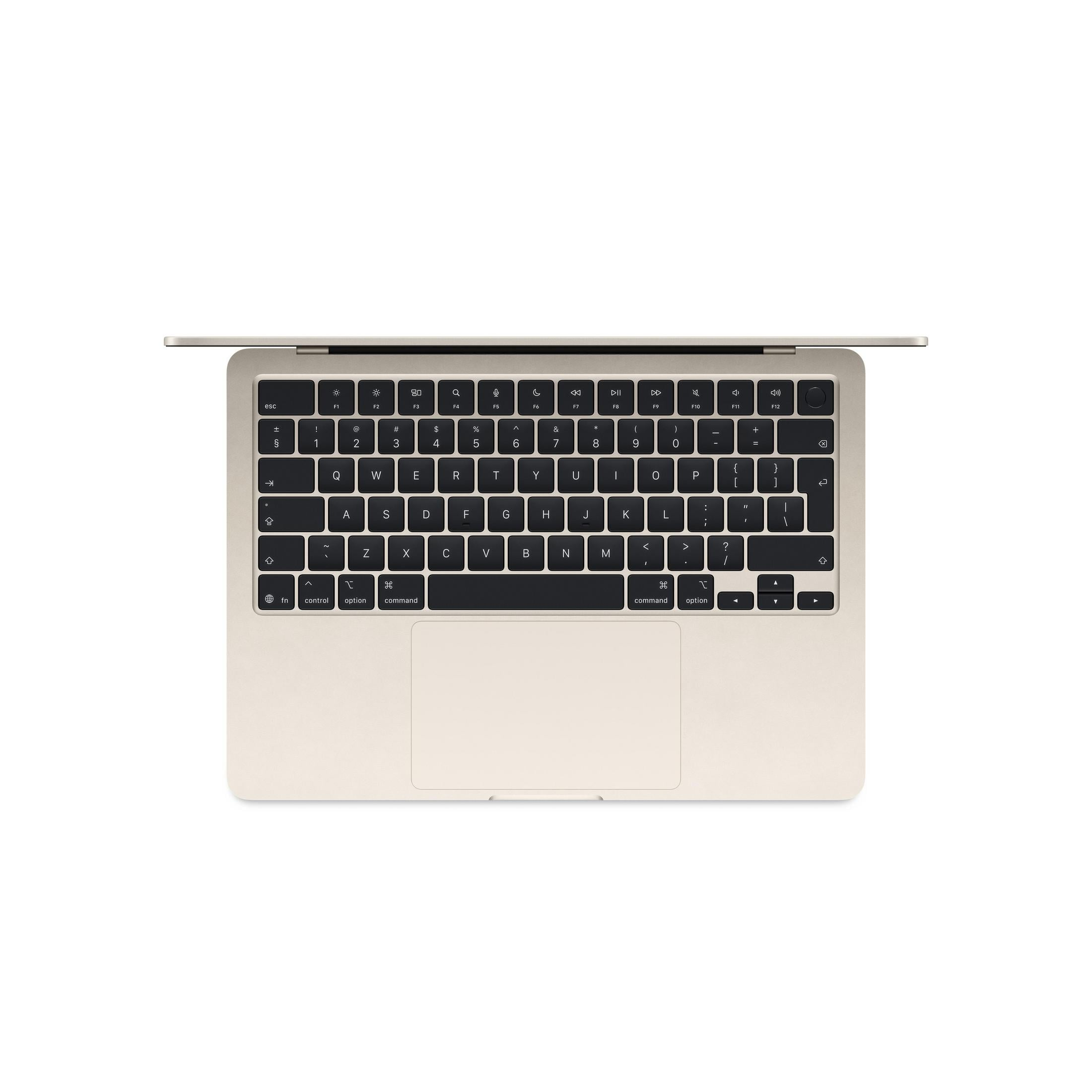 Clavier et trackpad d'ordinateur portable doré sur fond blanc.