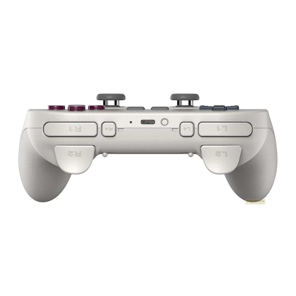 Biały kontroler do gier widok z góry z przyciskami i joystickami.