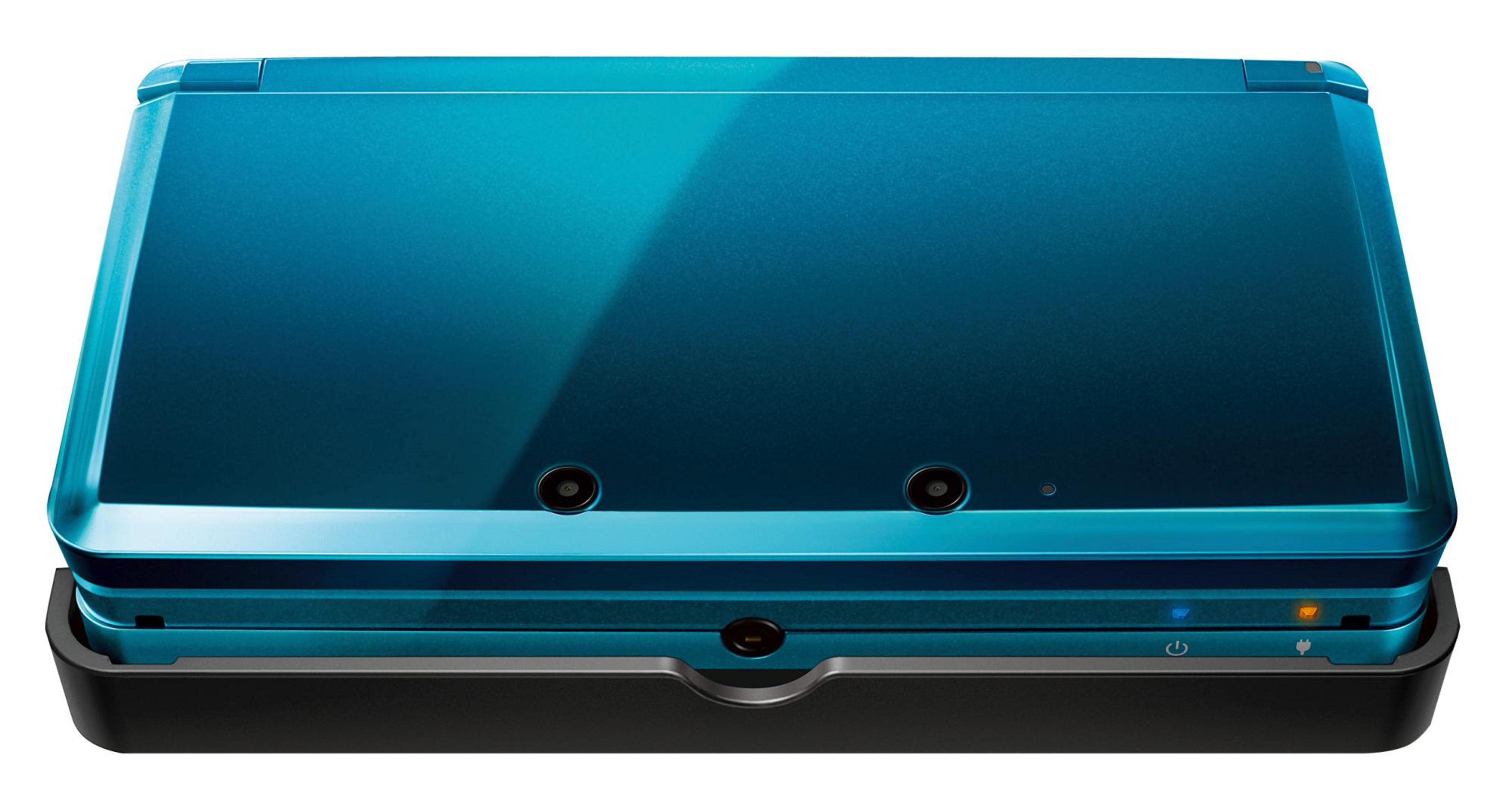 Ein blauer Nintendo 3DS XL in Ladestation mit Ladeanzeigen.
