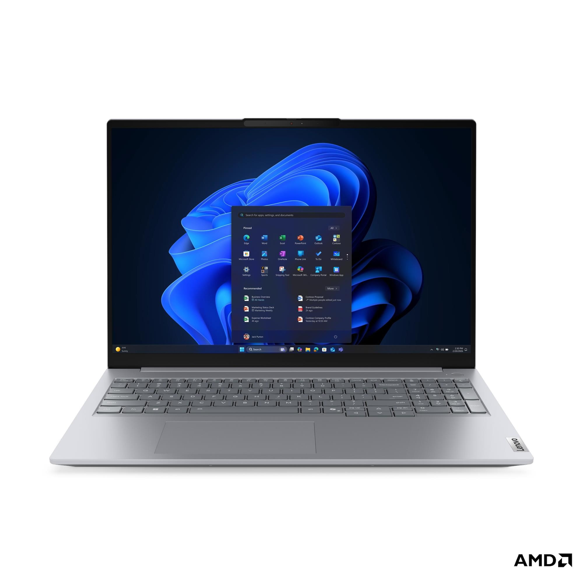 Un laptop argento con schermo illuminato che mostra il menu Start di Windows 11.