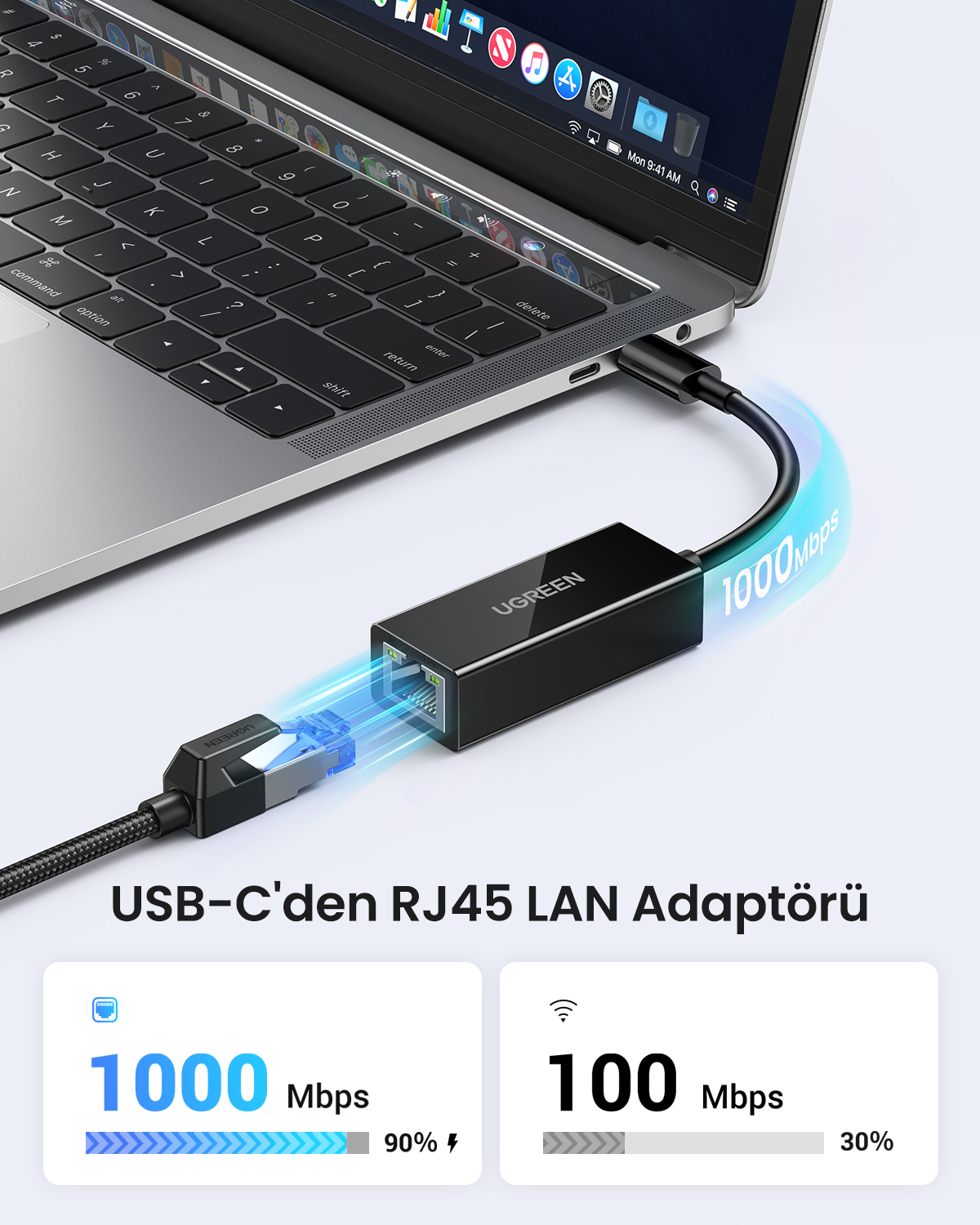 Siyah bir USB-C - RJ45 LAN adaptörü bir dizüstü bilgisayara bağlıdır.