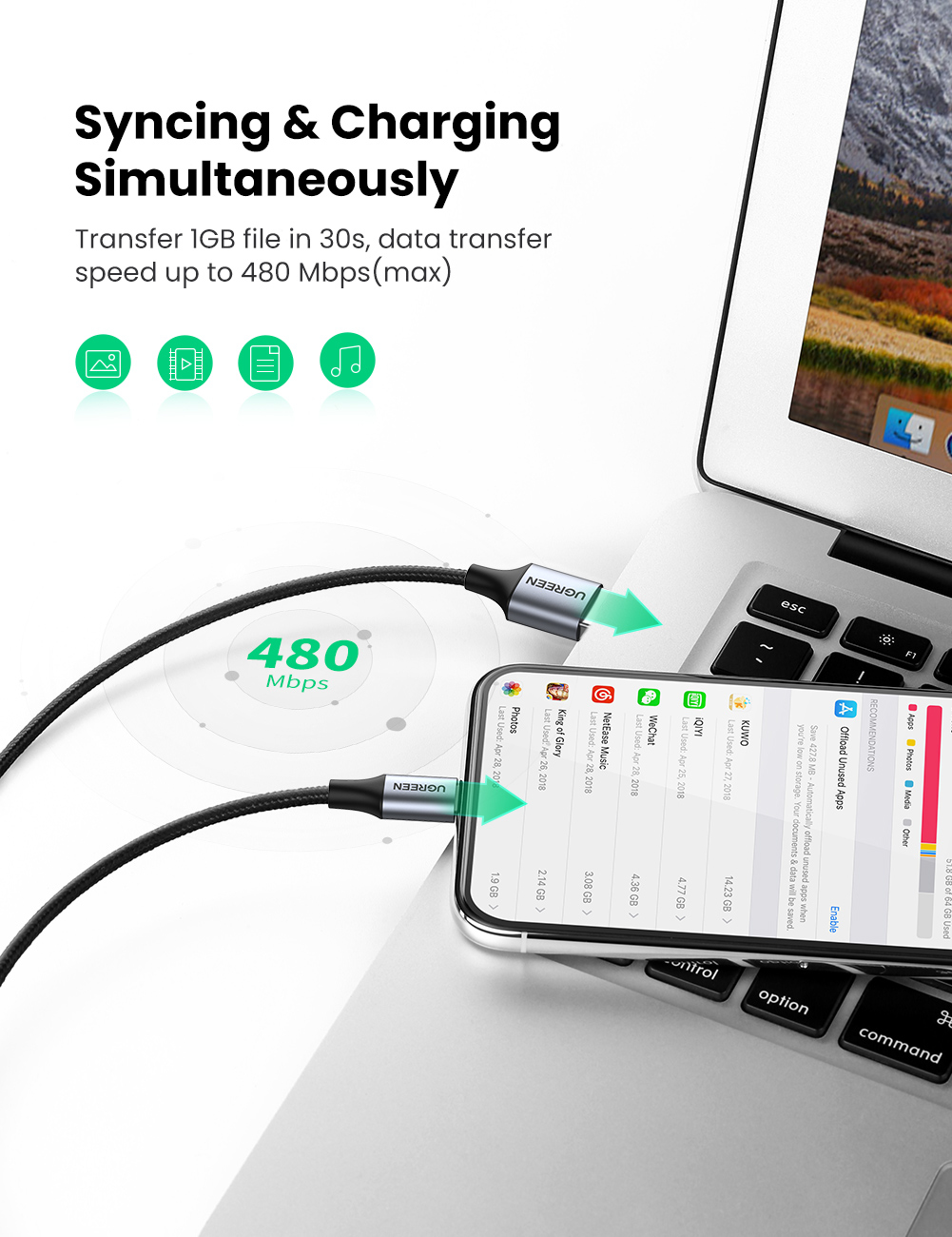 Gri USB-C kablosu akıllı telefonu bir dizüstü bilgisayara bağlıyor. Veri aktarım hızı 480 Mbps.
