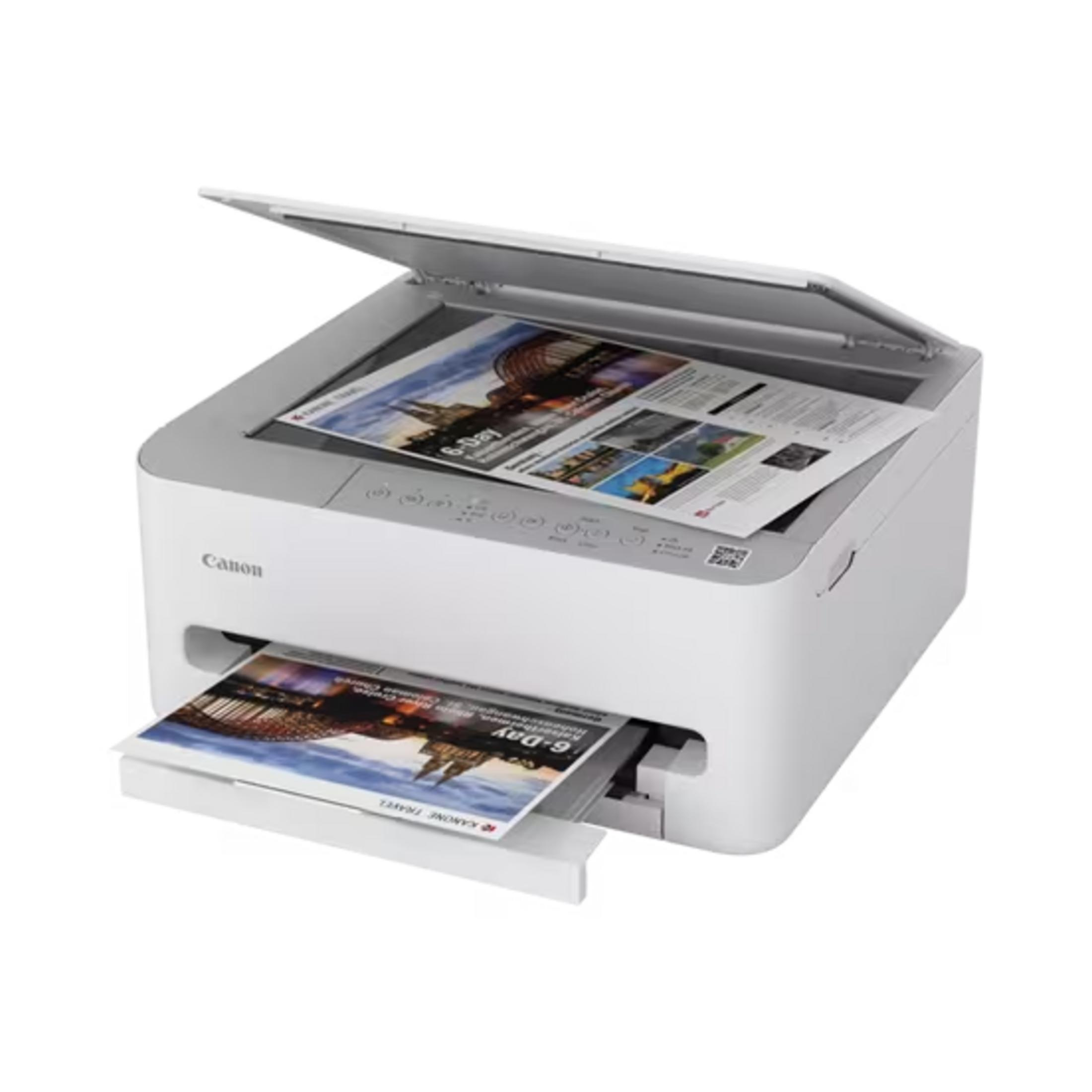 Ein weißer Canon-Drucker mit geöffnetem Scannerdeckel, der eine Reisebroschüre druckt.