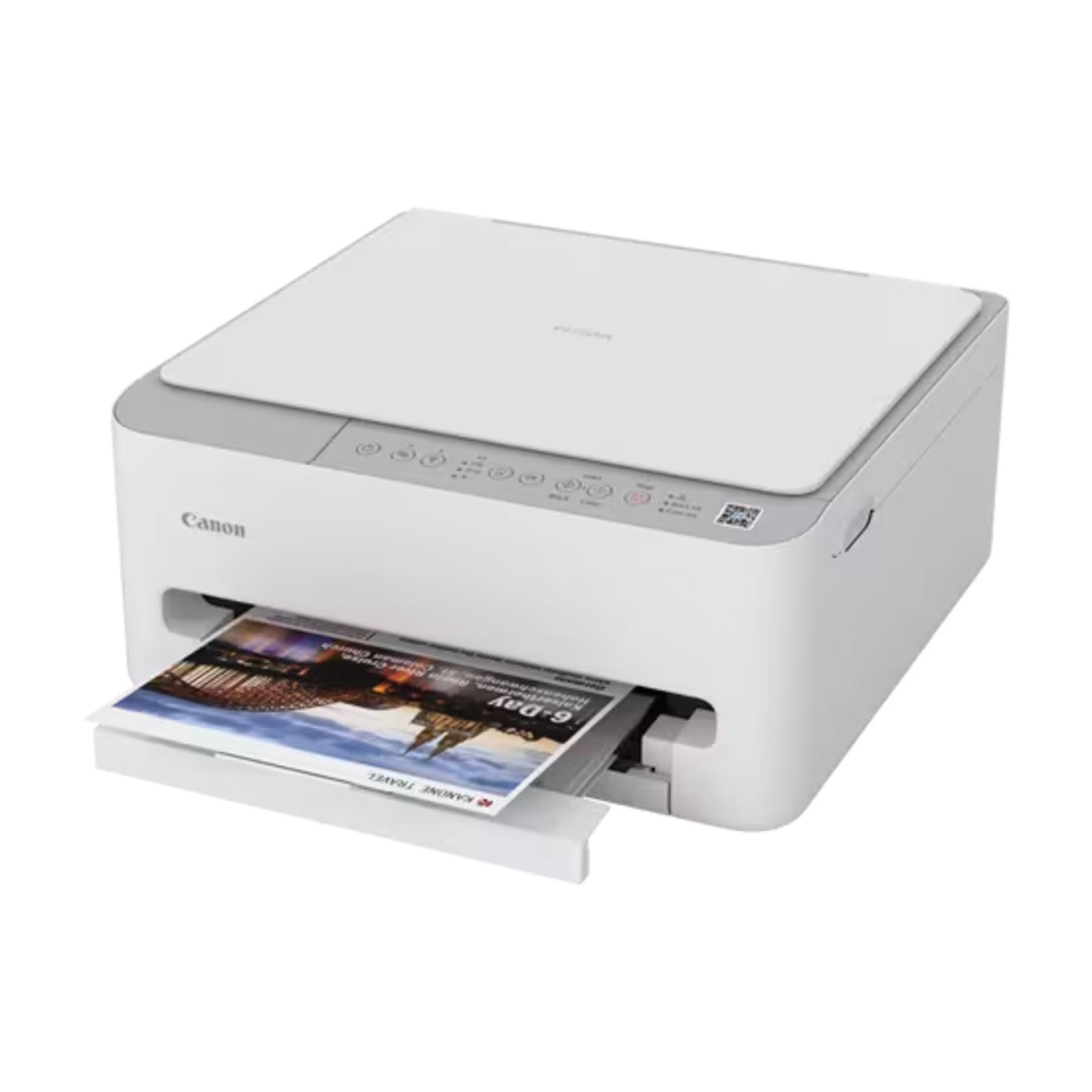 Ein weißer Canon Drucker mit einem Farbausdruck, der teilweise herausragt.