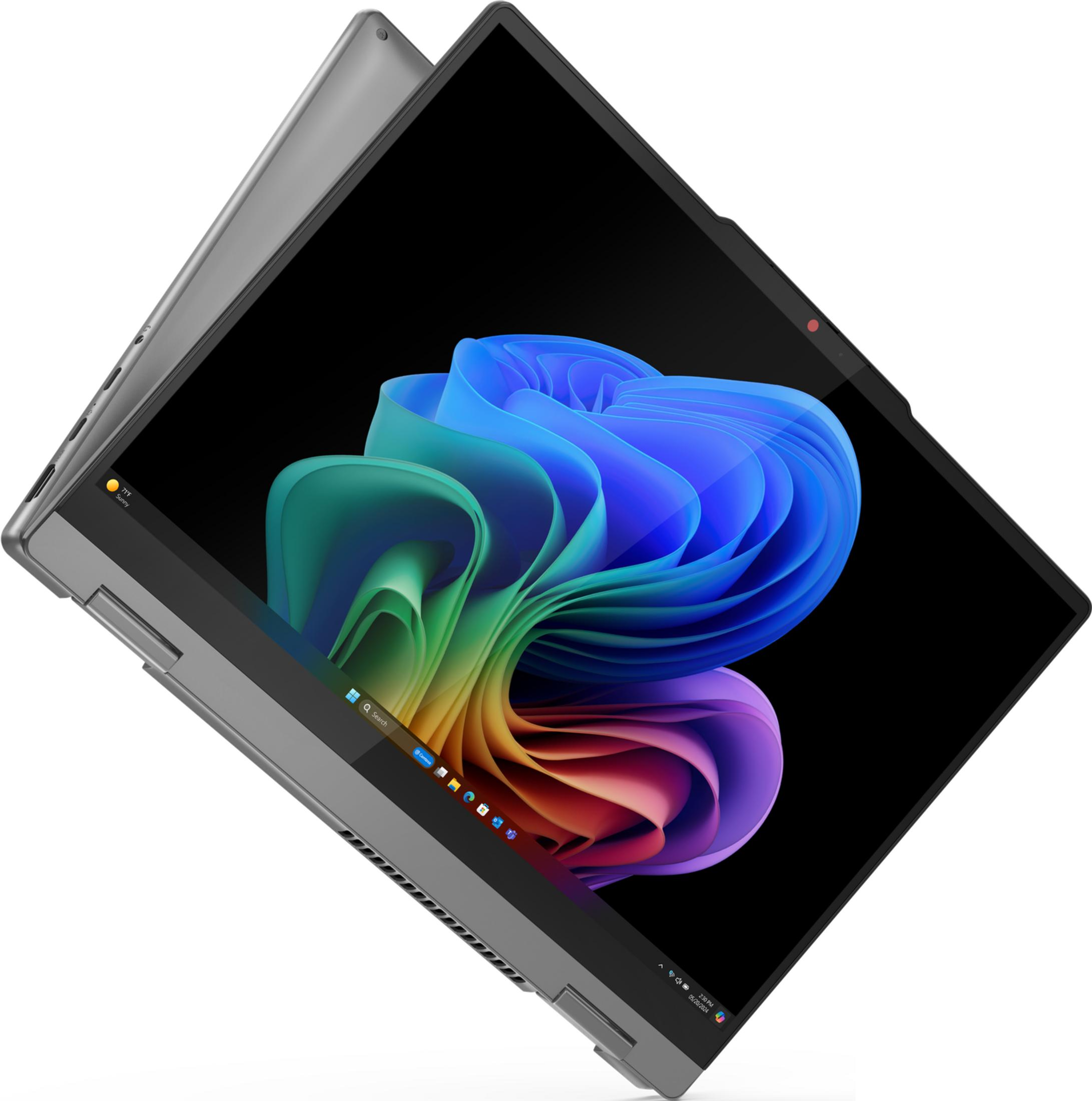 Ein graues Laptop mit einem bunten Hintergrundbild auf dem Bildschirm.