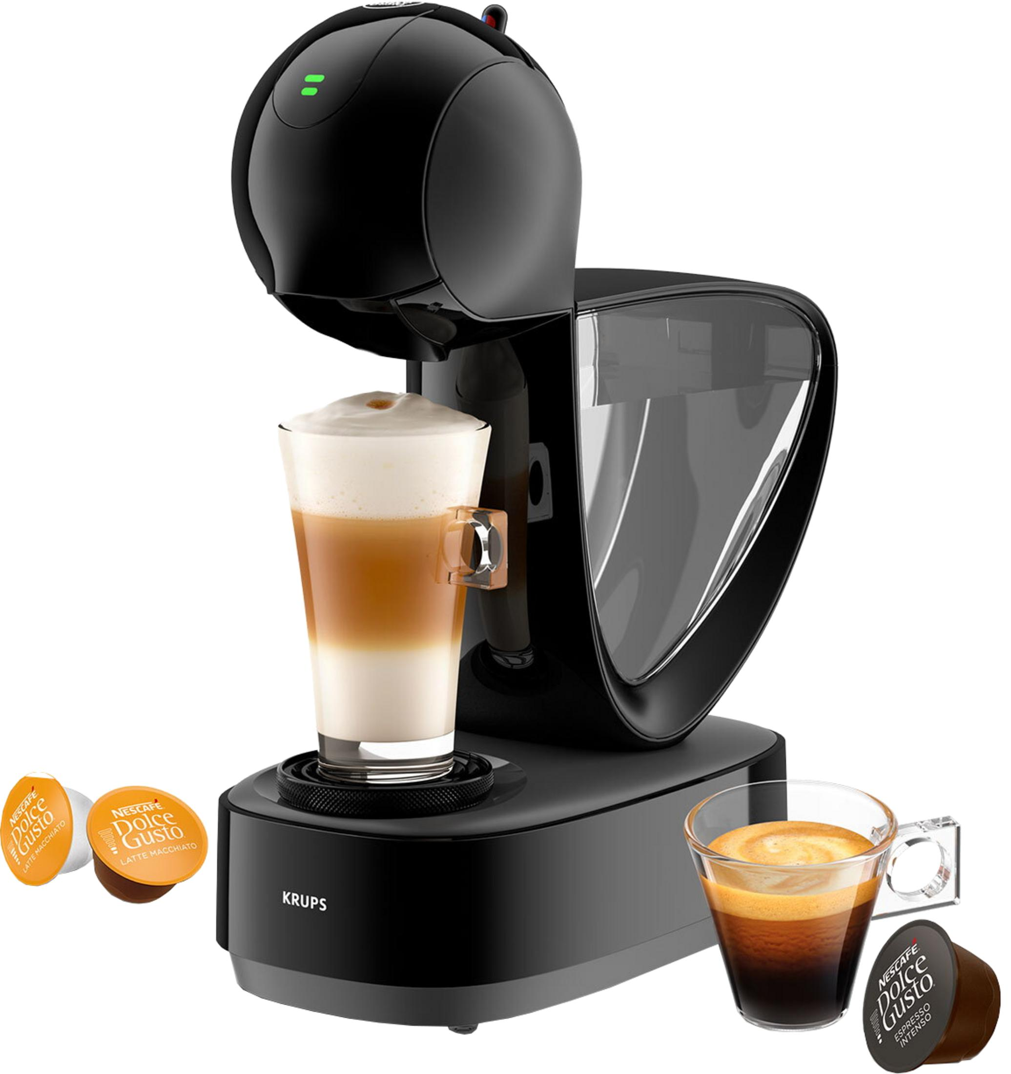 Una macchina da caffè nera con un bicchiere di latte macchiato e capsule.